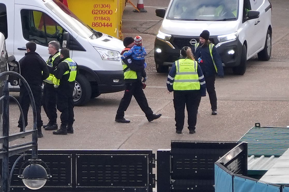 A group of people thought to be migrants, including young children, are brought into Dover, Kent, from a Border Force vessel following a small boat incident in the Channel (Gareth Fuller/PA)