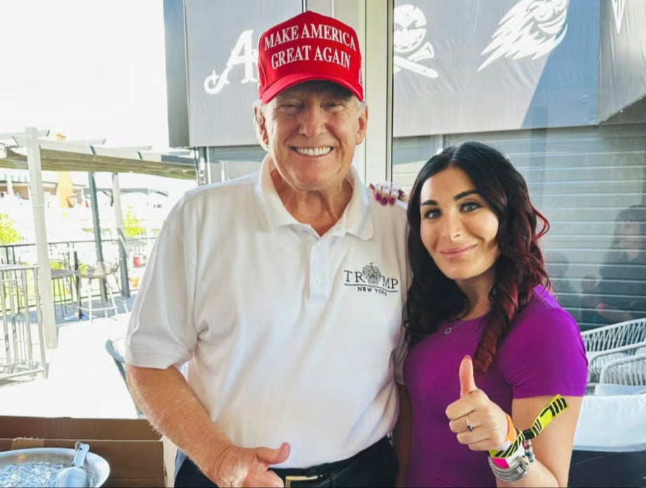 Donald Trump and Laura Loomer pose at LIV golf event in August 2023