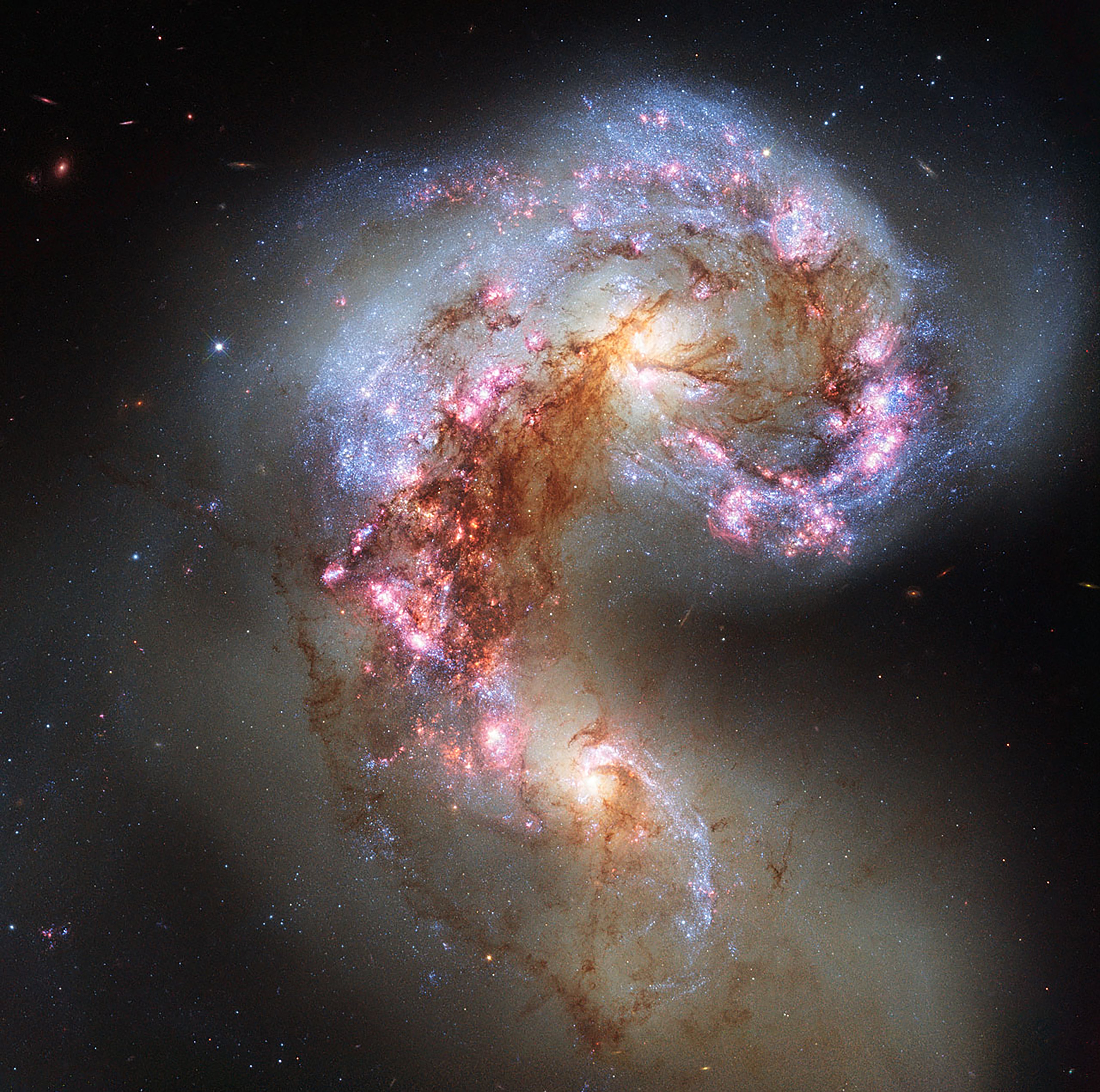 Two antennae galaxies colliding. v from University of Southampton believe galaxies crashed together to create gigantic elliptical galaxies.