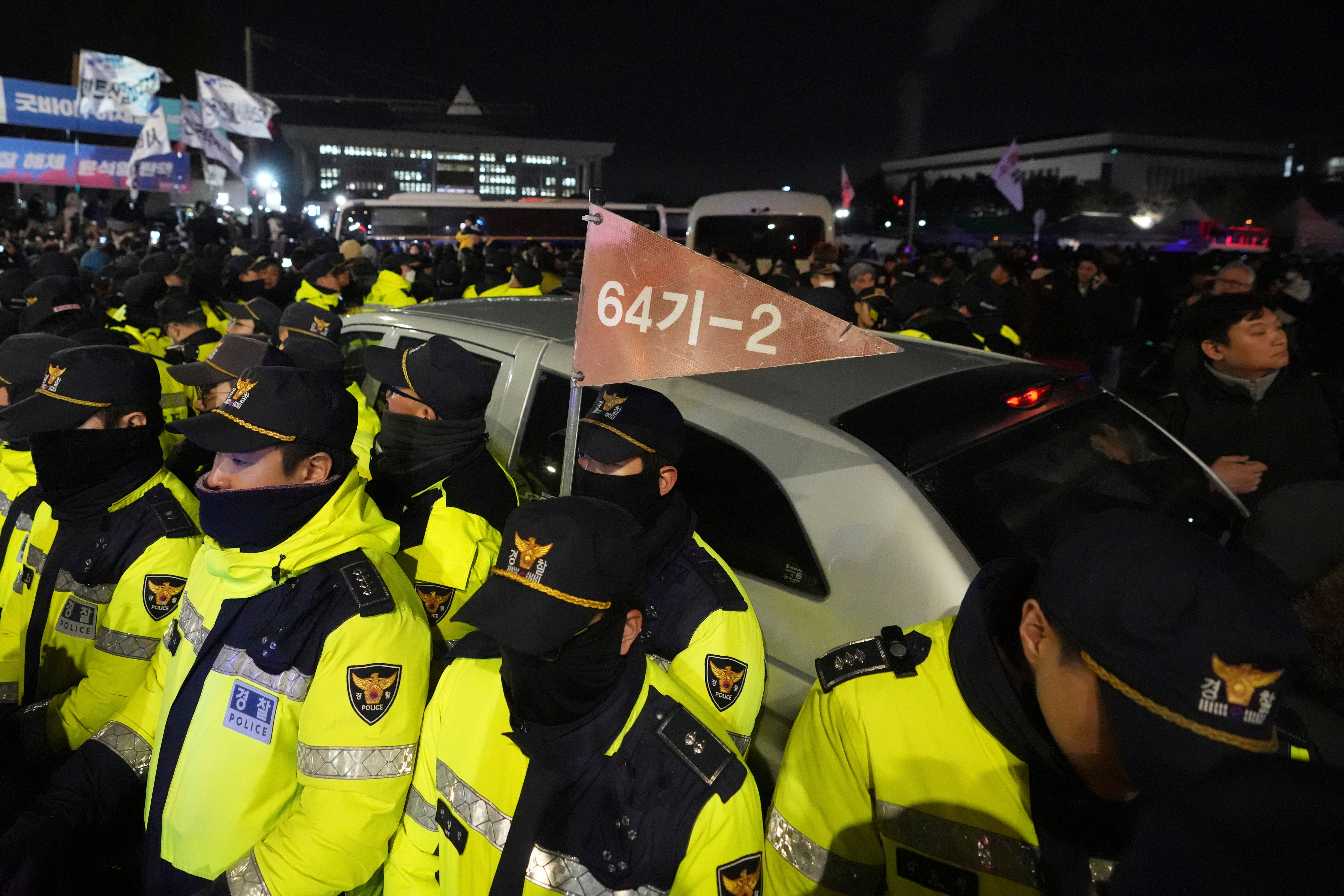 Police officers stand outside the National Assembly in Seoul, South Korea, Wednesday, 4 Dec 2024