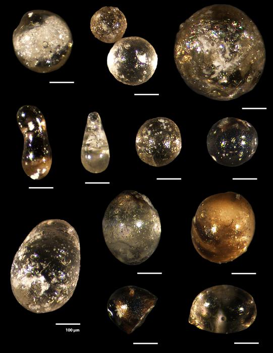 Silica droplets, or microspherules, are seen in this image. One is about 100 microns in size