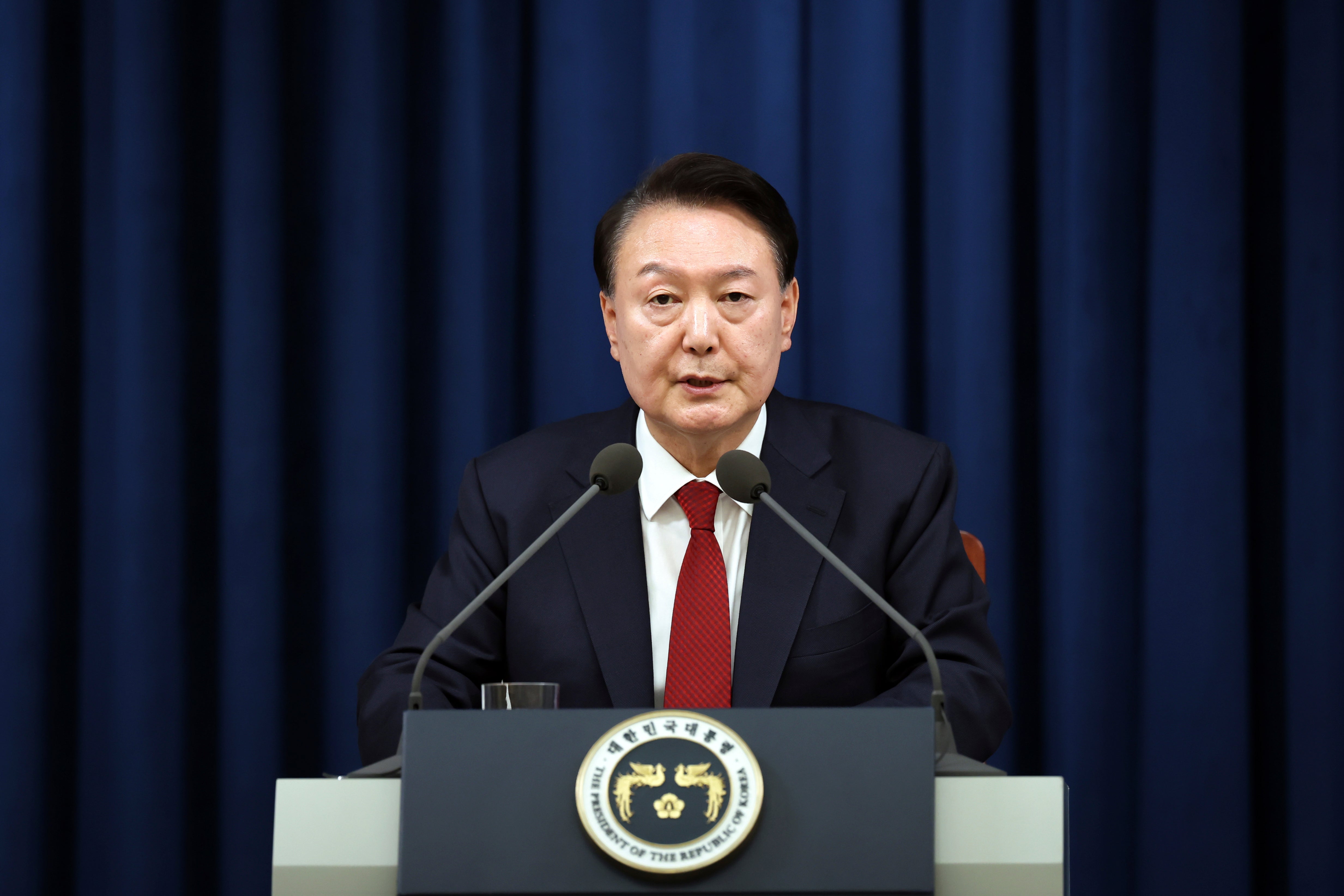 In this photo provided by South Korea Presidential Office, South Korean President Yoon Suk Yeol speaks during a press briefing at the presidential office in Seoul, South Korea, Tuesday, 3 Dec 2024