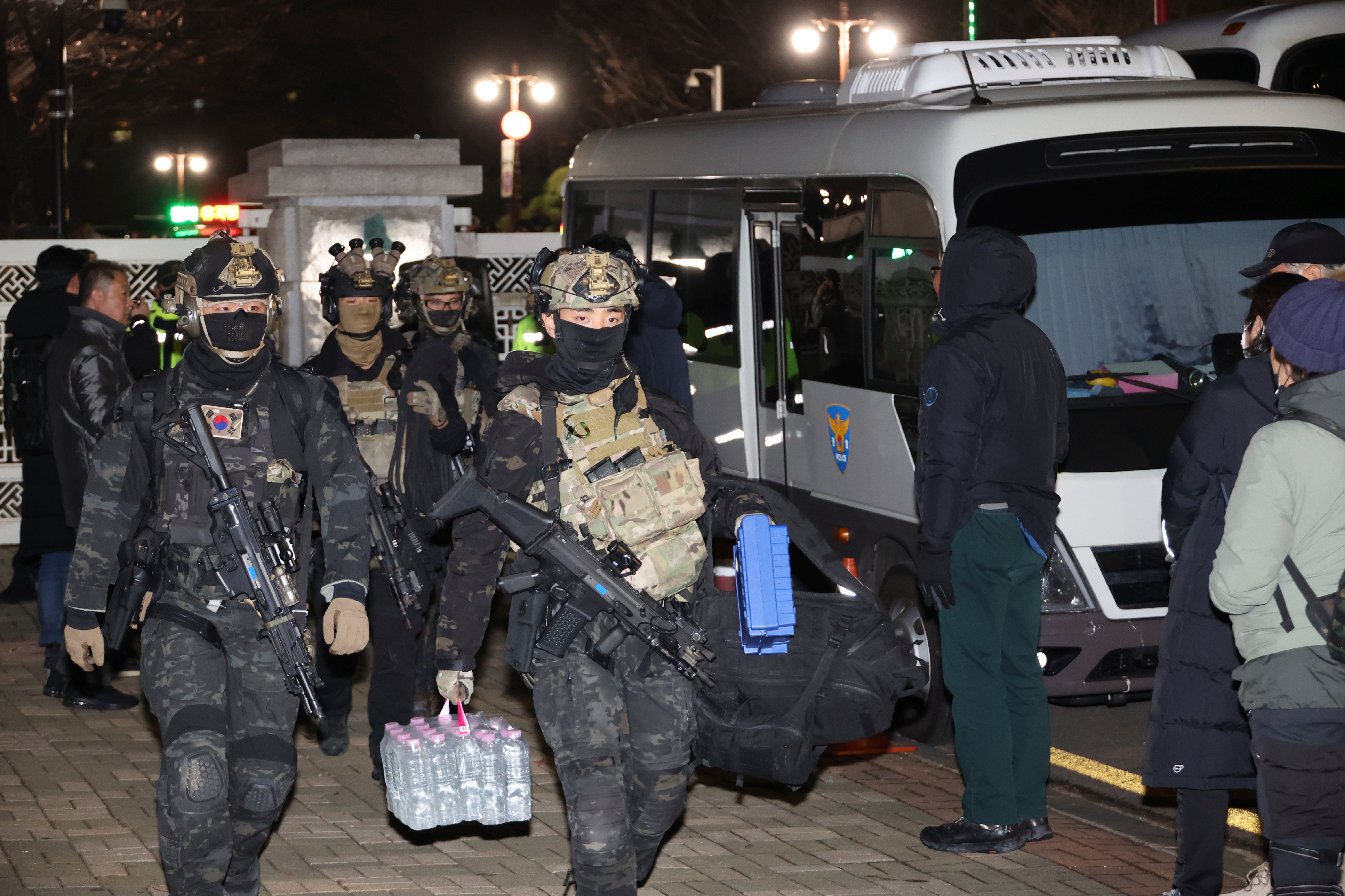 South Korean martial law soldiers leave the National Assembly in Seoul, South Korea, Wednesday, 4 Dec 2024