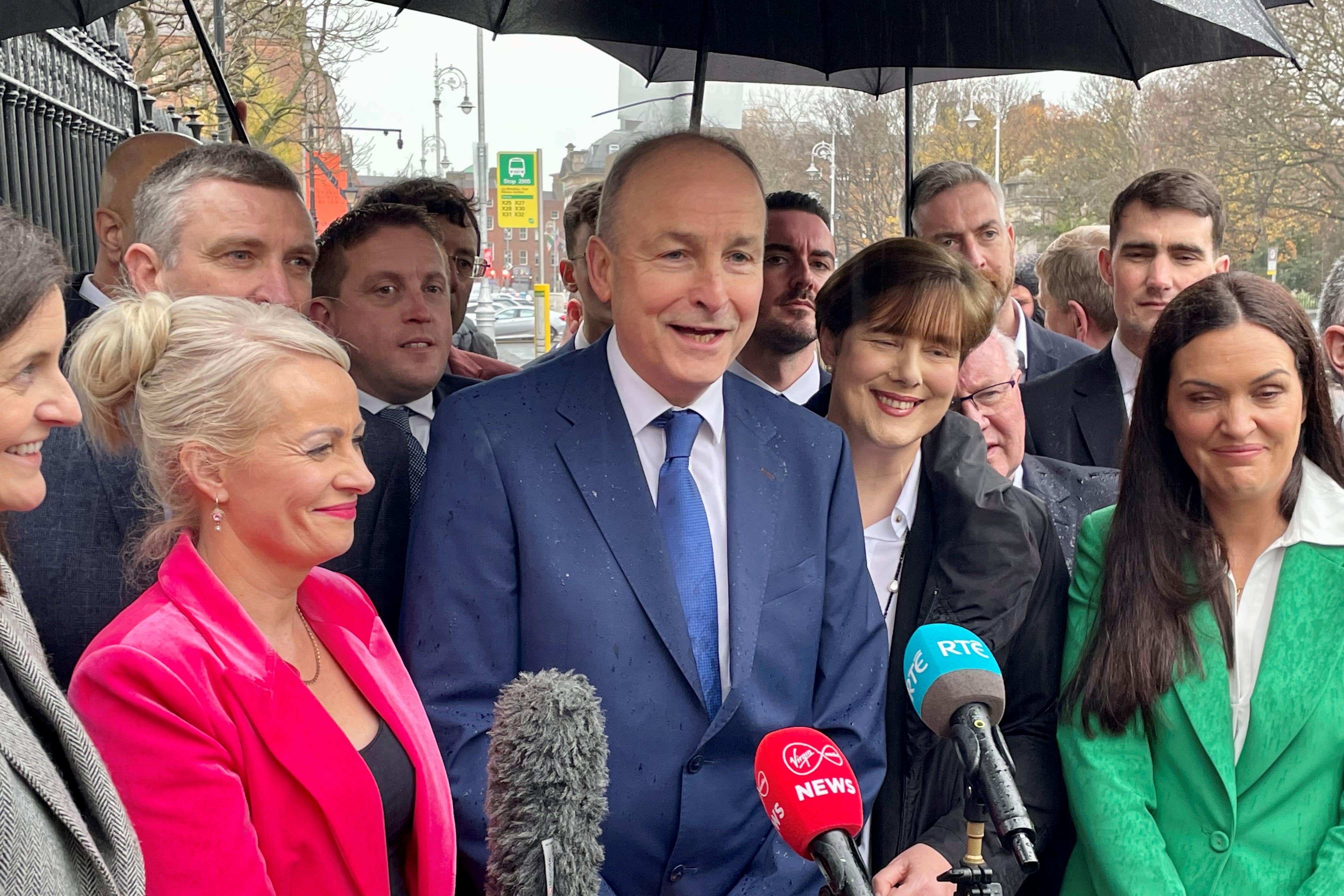 Fianna Fail leader Micheal Martin, centre, speaking to the media outside Leinster House in Dublin