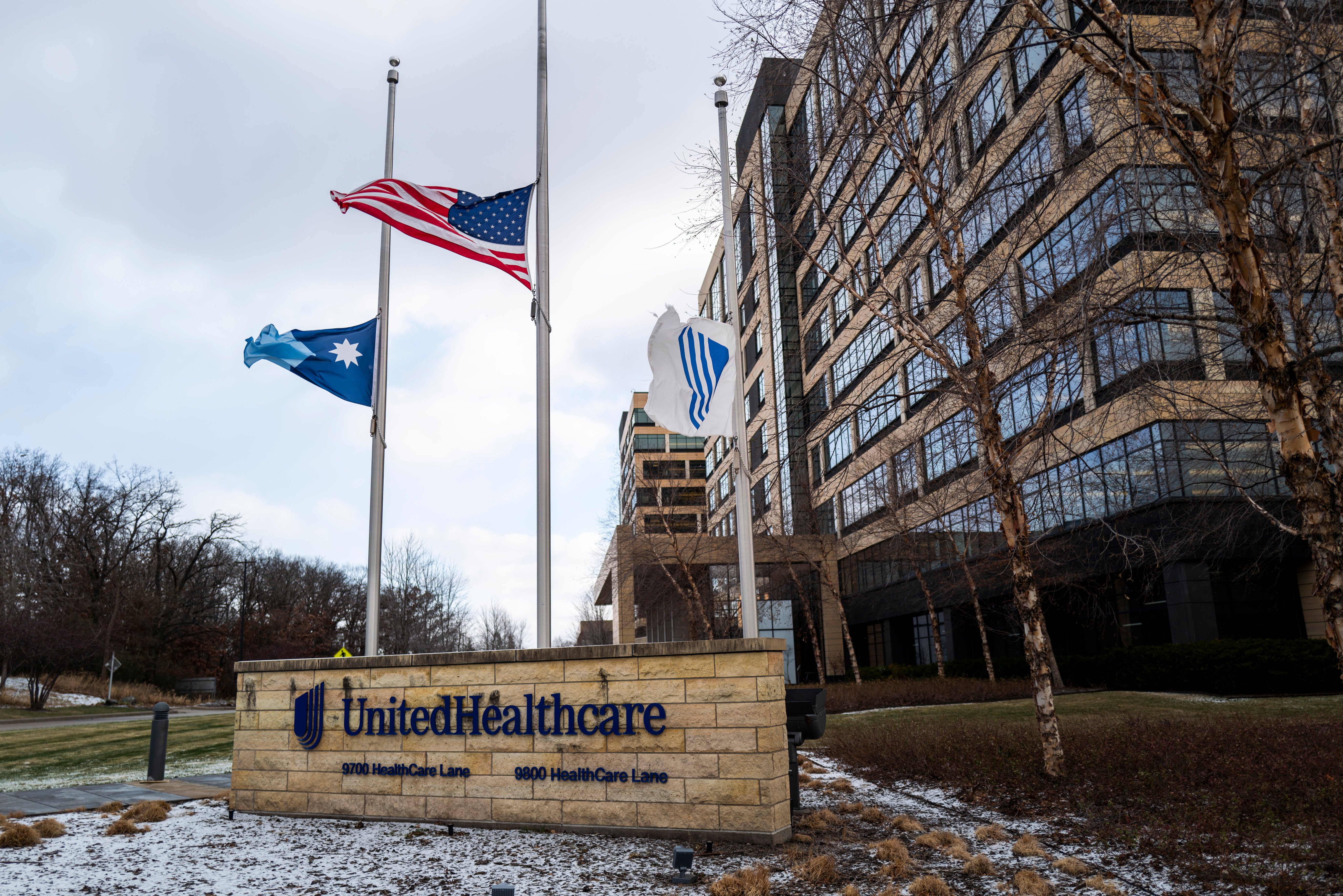 Flags fly at half mast outside the UnitedHealthcare corporate headquarters in Minnetonka, Minnesota. Thompson’s family described him as a “loving, generous, talented man”