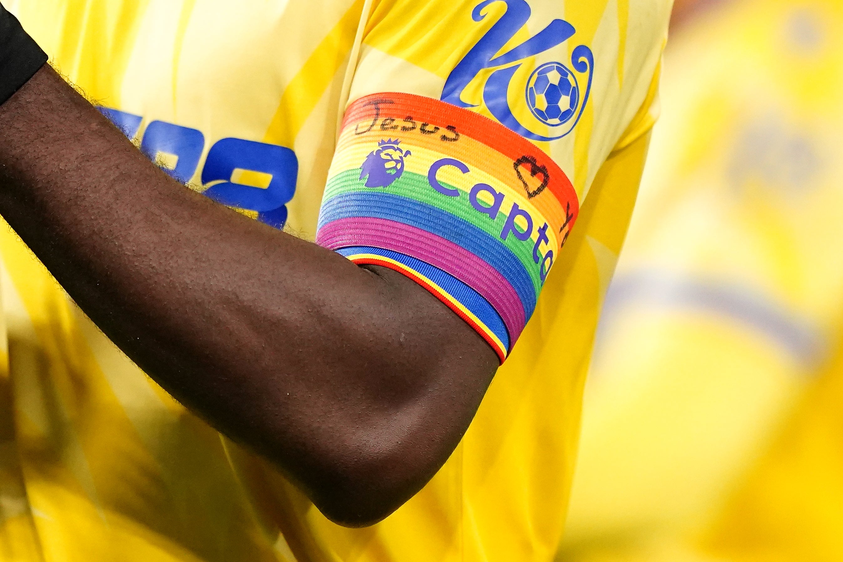 Crystal Palace’s Marc Guehi wearing the Rainbow Laces captain’s armband, with the written message ‘Jesus loves you’