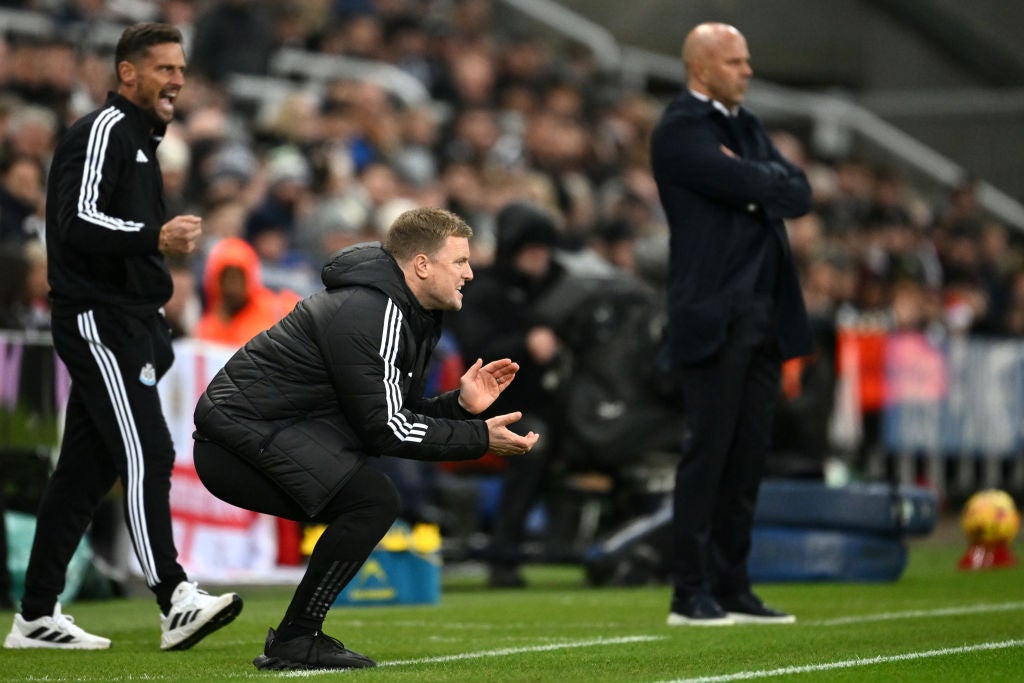 Eddie Howe and Arne Slot watch on from the touchline