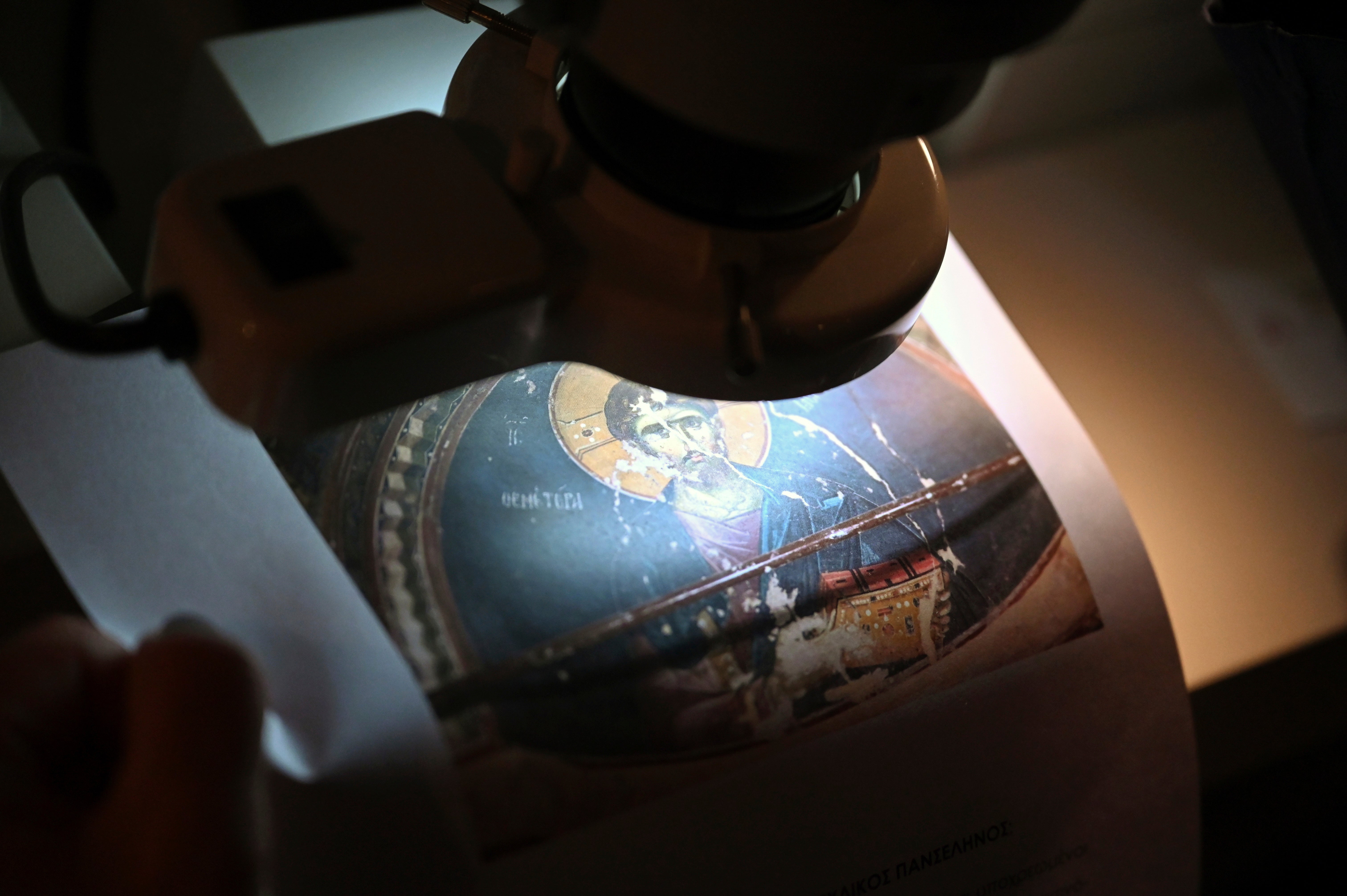 Christina Sotirakoglou a handwriting expert, observes Byzantine paintings based on photographs prints