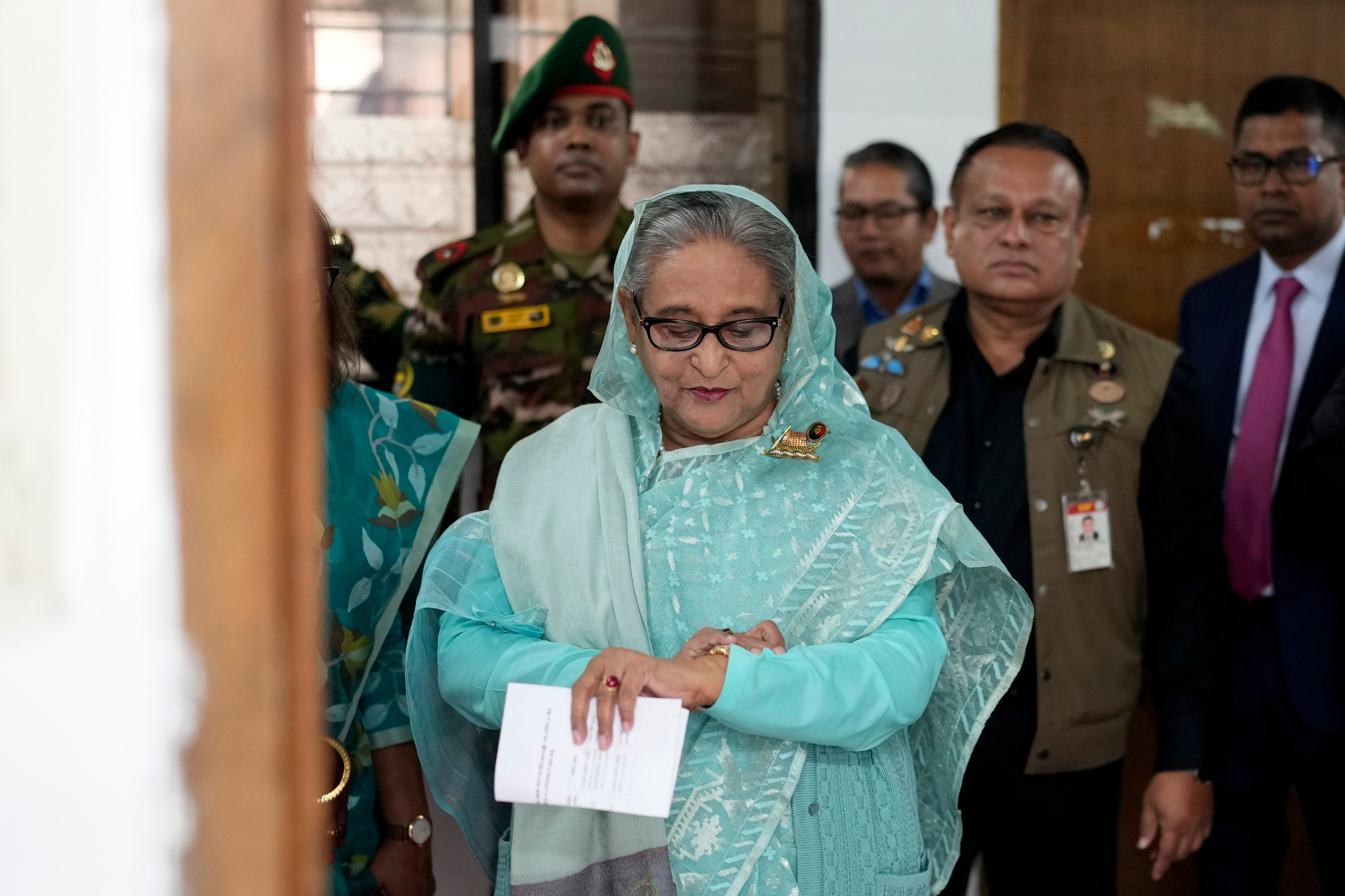 Sheikh Hasina waits to cast her vote in Bangladesh’s general election in Dhaka on 7 January 2024