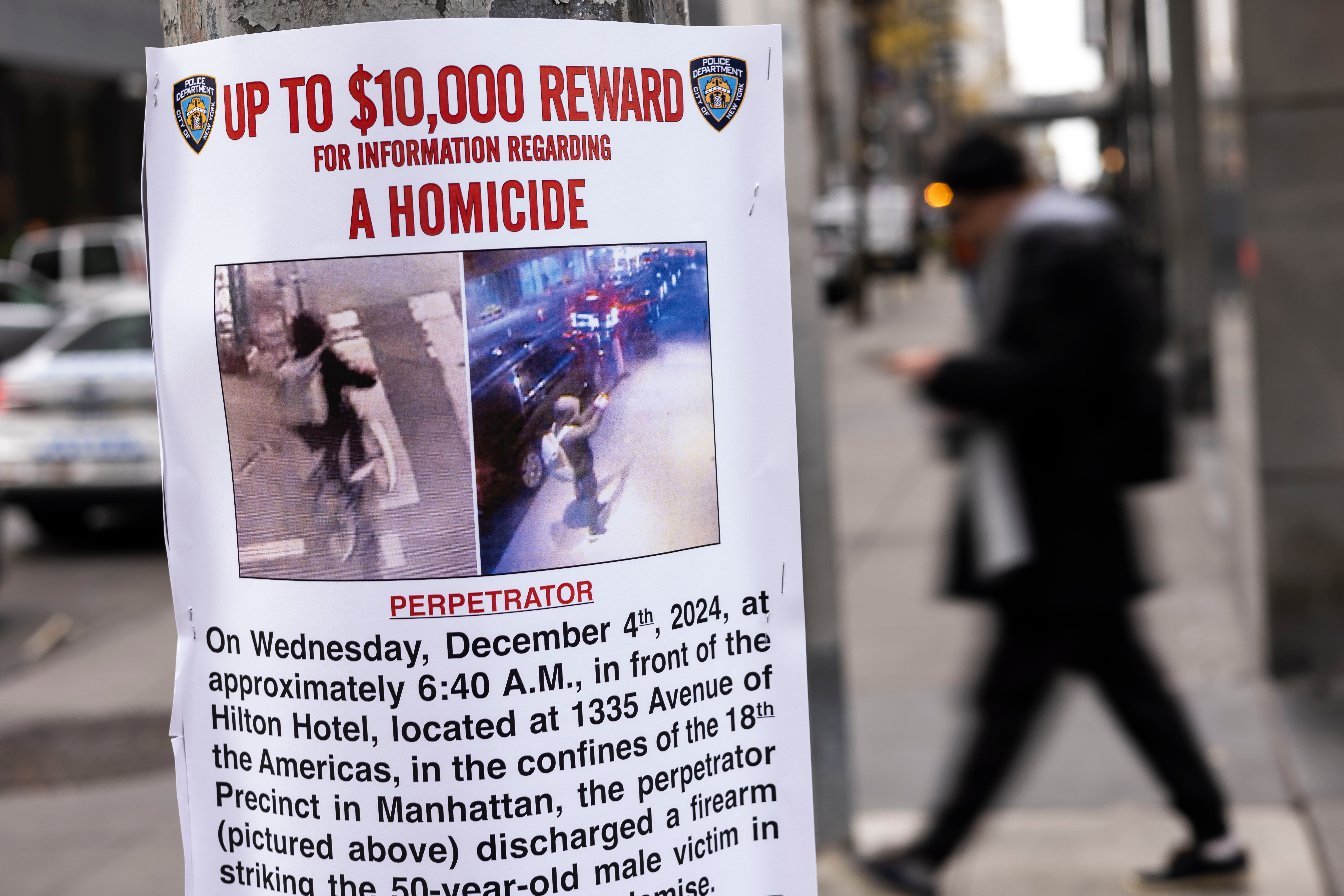 A 'Wanted' poster put up by the NYPD outside of the New York Hilton hotel near the scene where Thompson was shot dead