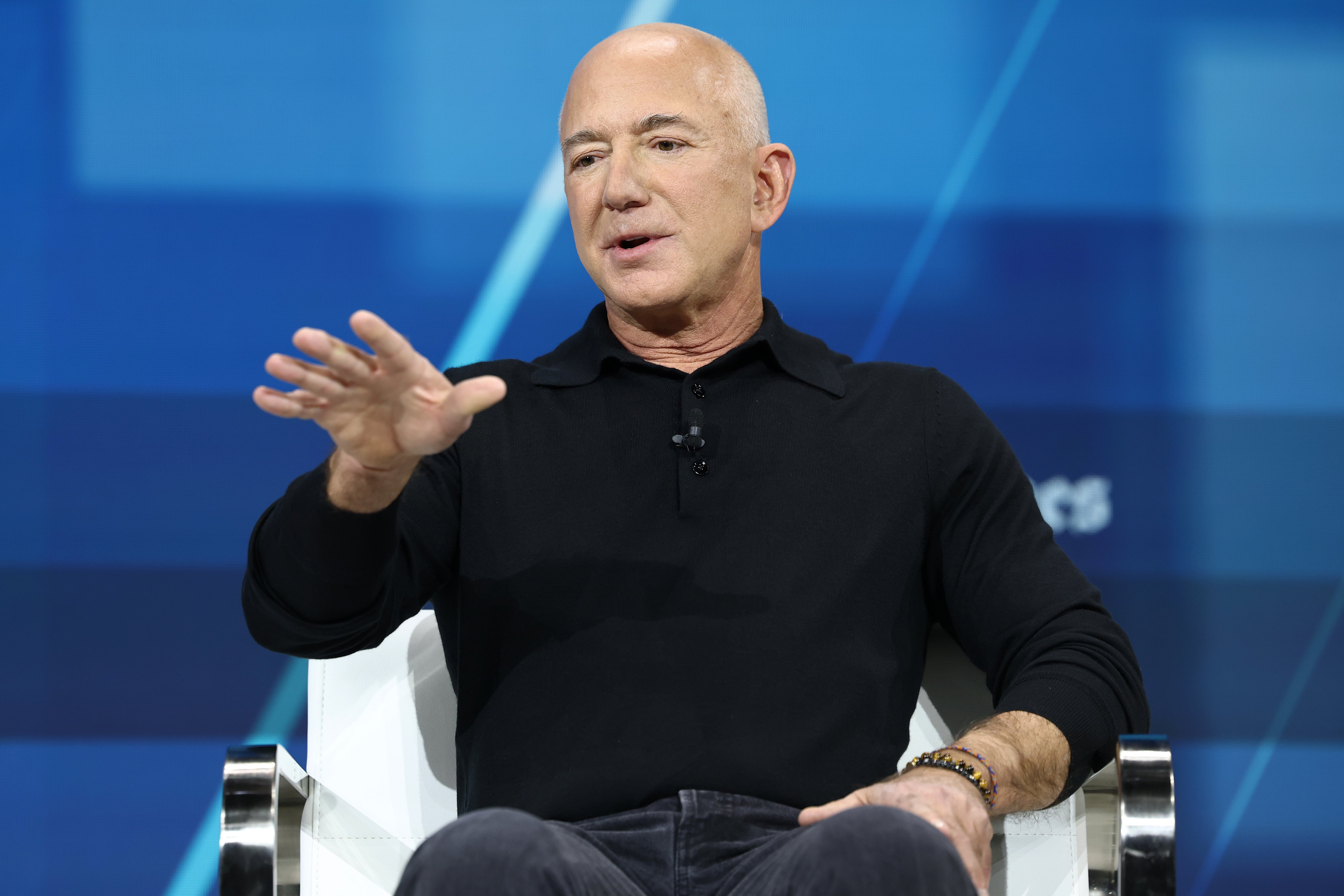 Jeff Bezos, founder and executive chairman of Amazon and owner of the Washington Post, speaks during the New York Times annual DealBook summit. Kara Swisher is pitching a bid to purchase the Post from Bezos.