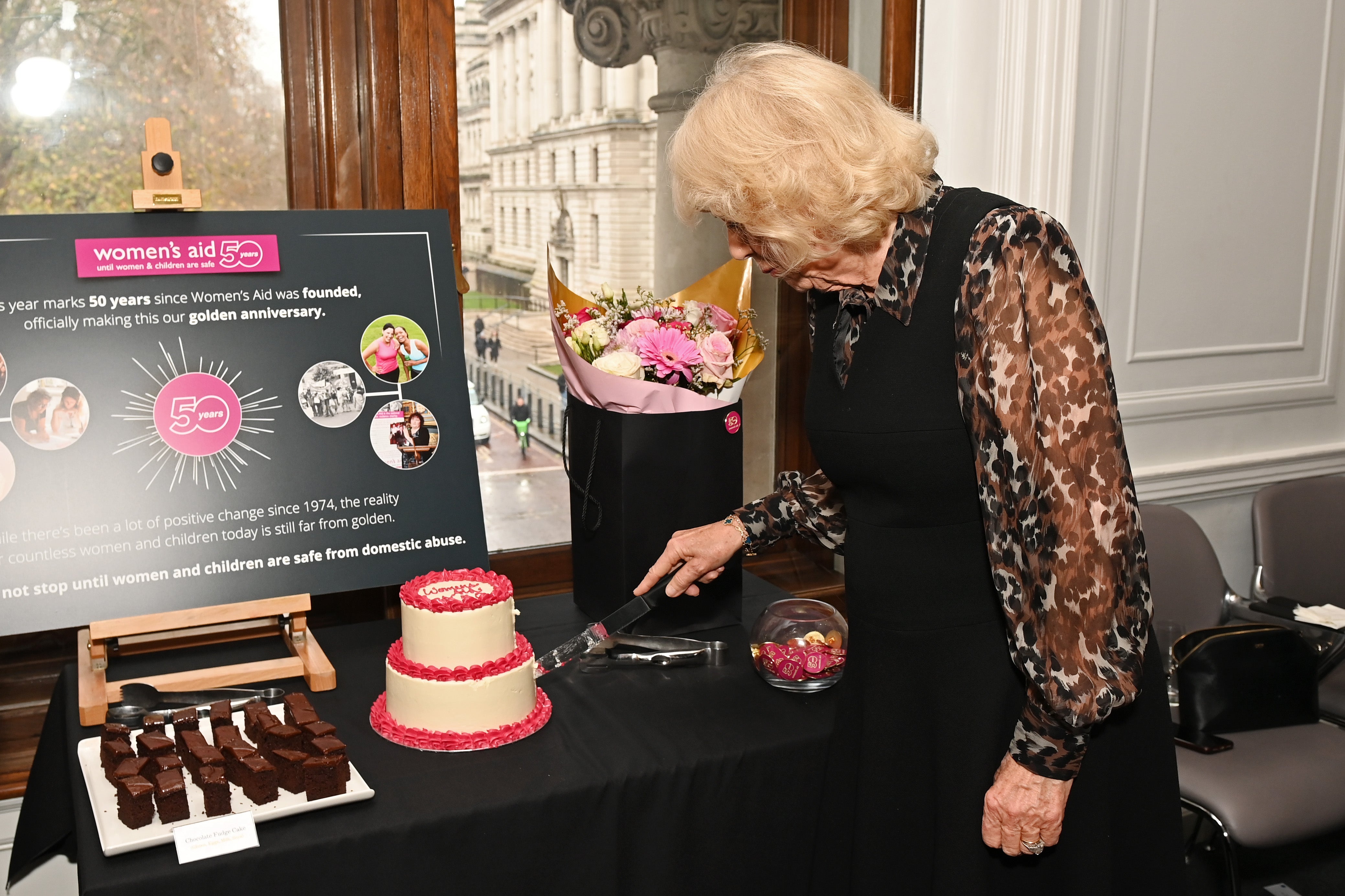 She looked relaxed as she joined the large group of women in London before cutting the 50th birthday cake