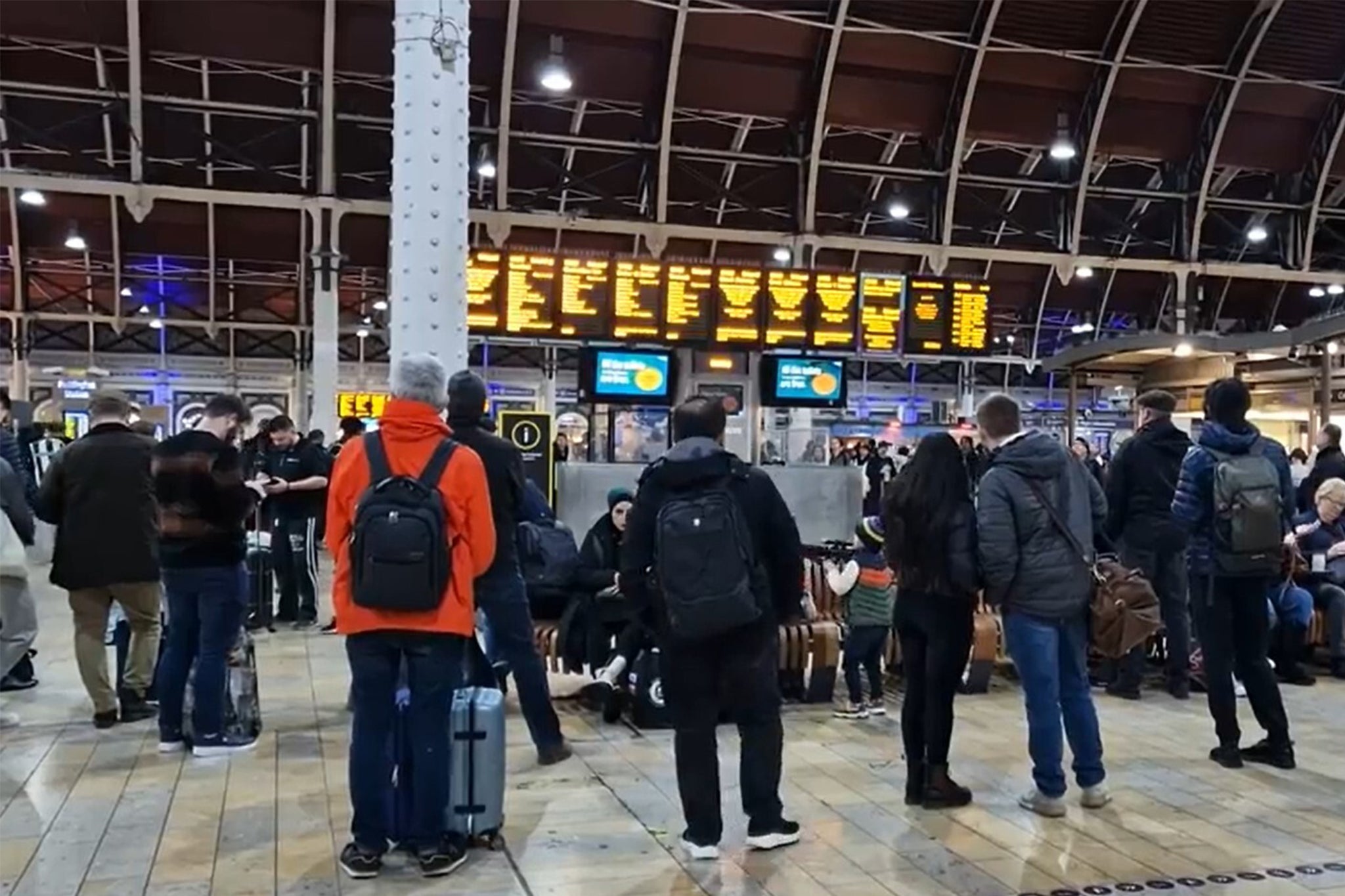 Travellers at Paddington railway station in London