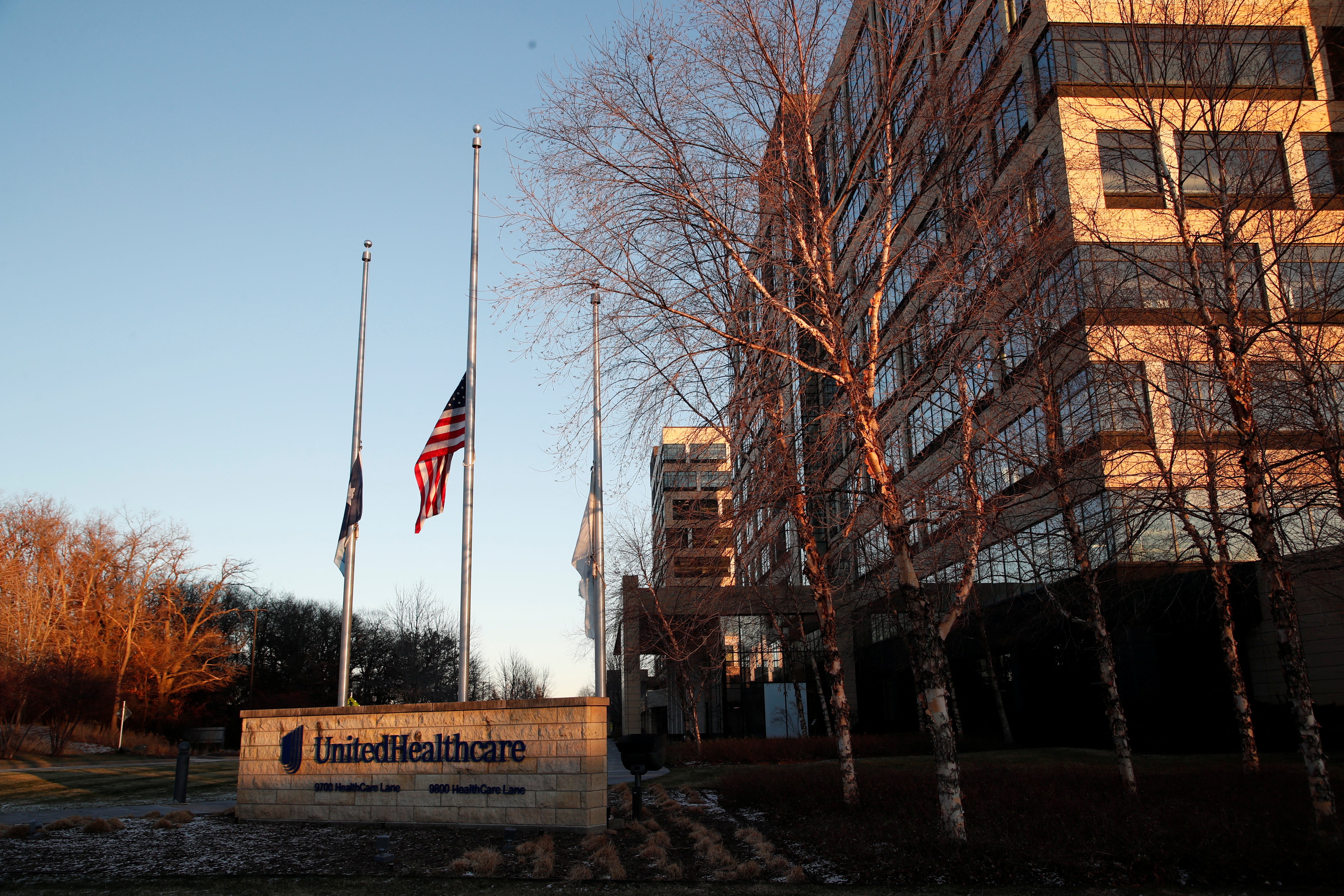 Flags fly at half-staff at the Minnetonka, Minnesota, office of UnitedHealthcare after company CEO Brian Thompson was shot dead in Manhattan. REUTERS/Eric Miller