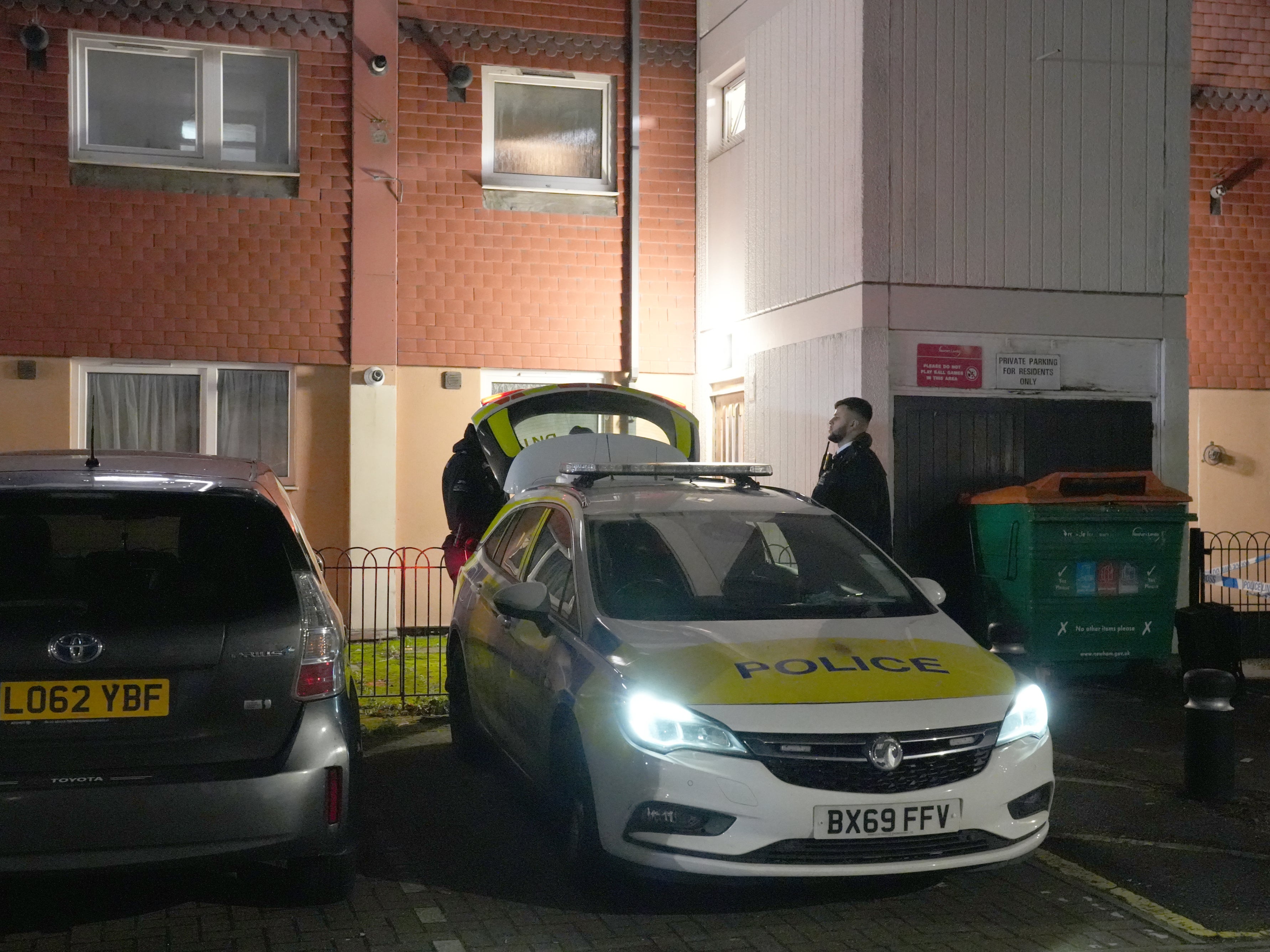 Police officers attend Shirley Road in Stratford, east London, where a man has died after being fatally injured by a dog on Wednesday morning