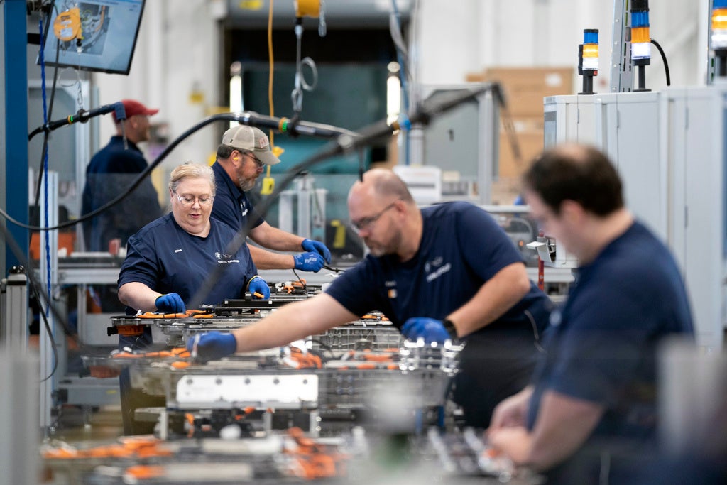 Employees work in the battery assembly hall at the BMW Spartanburg plant in Greer, S.C