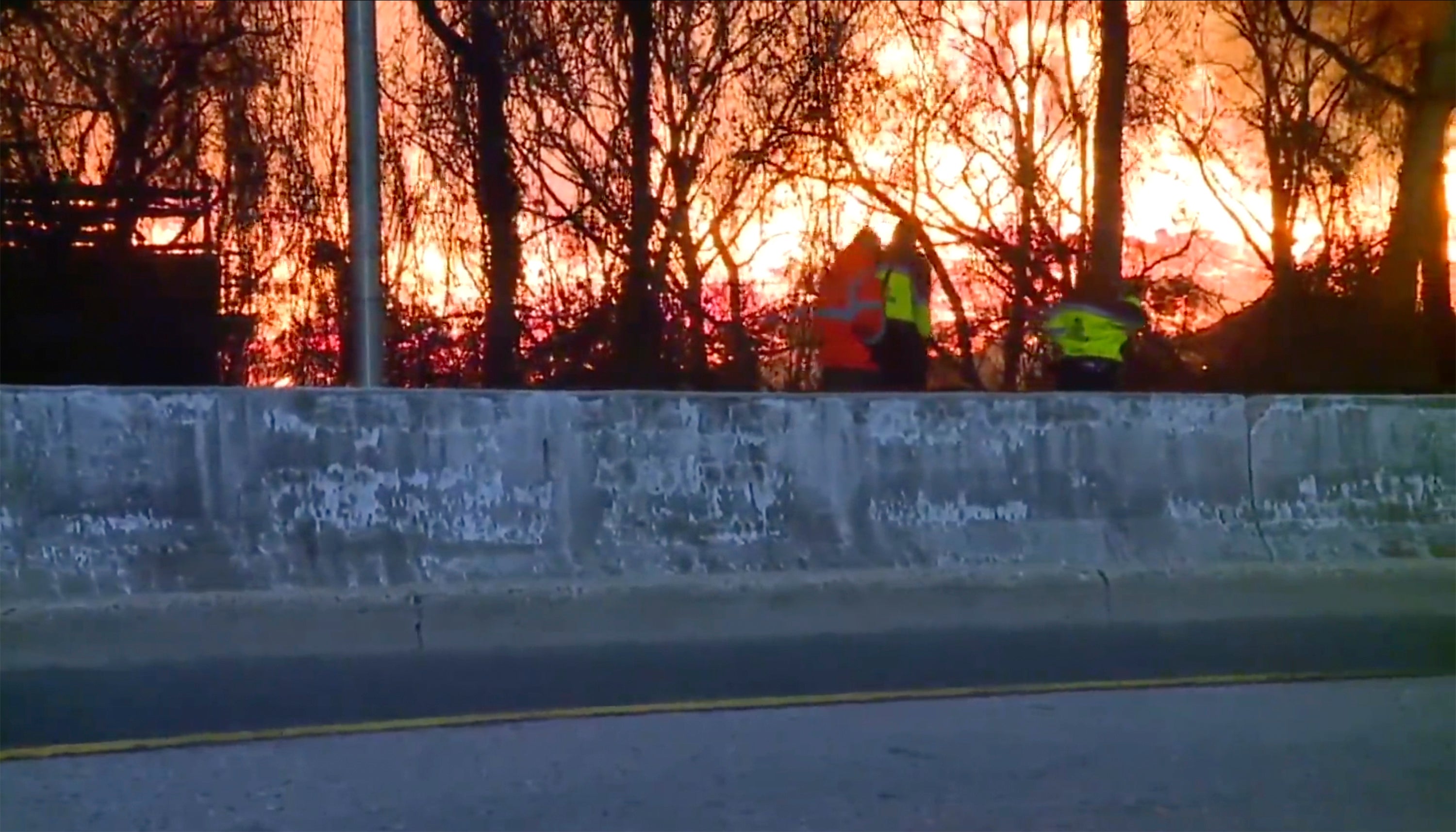 Firefighters have contained a massive brush fire that led to road closures near Baltimore