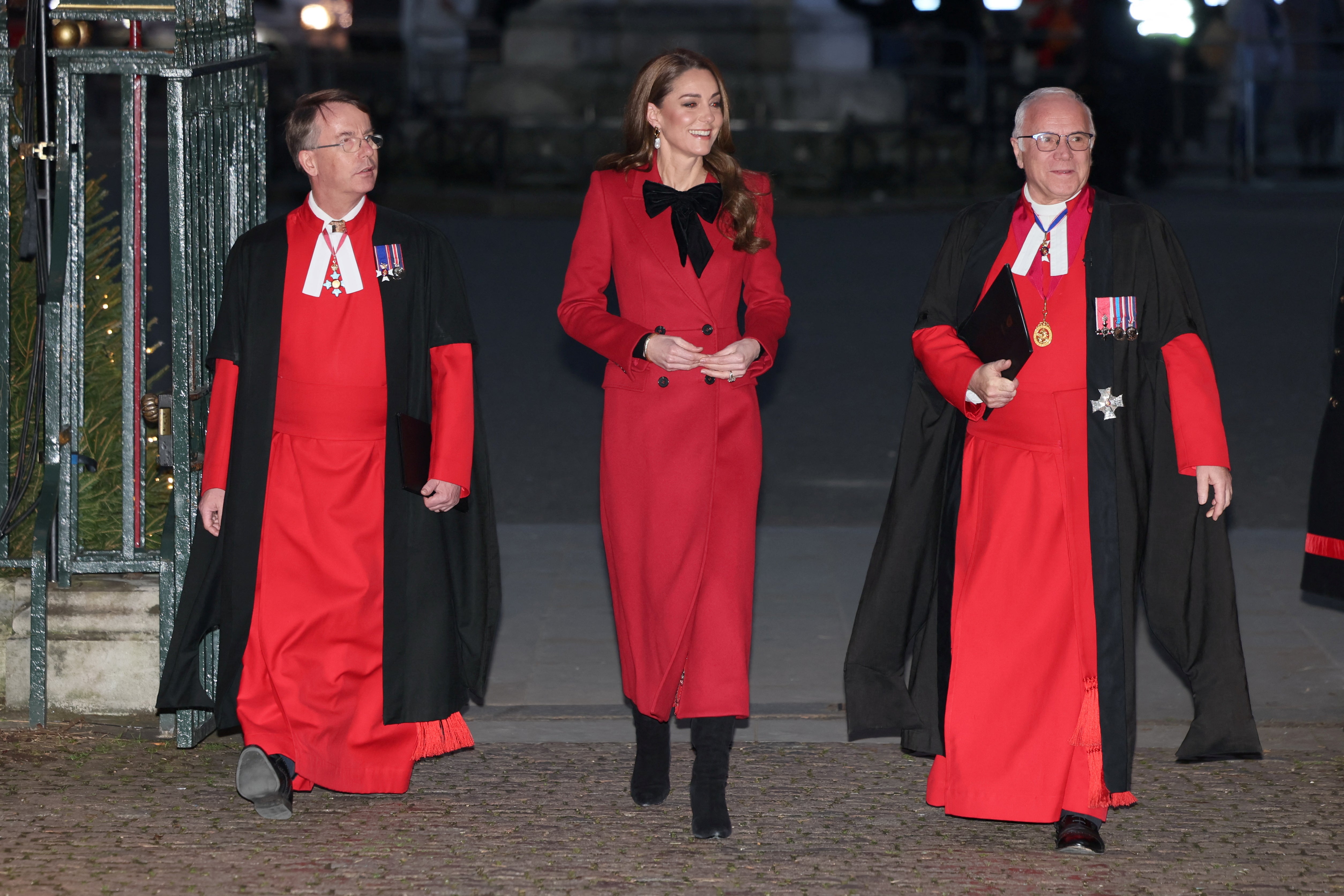 Kate wore a bold red with accents of black during her annual Christmas carol event