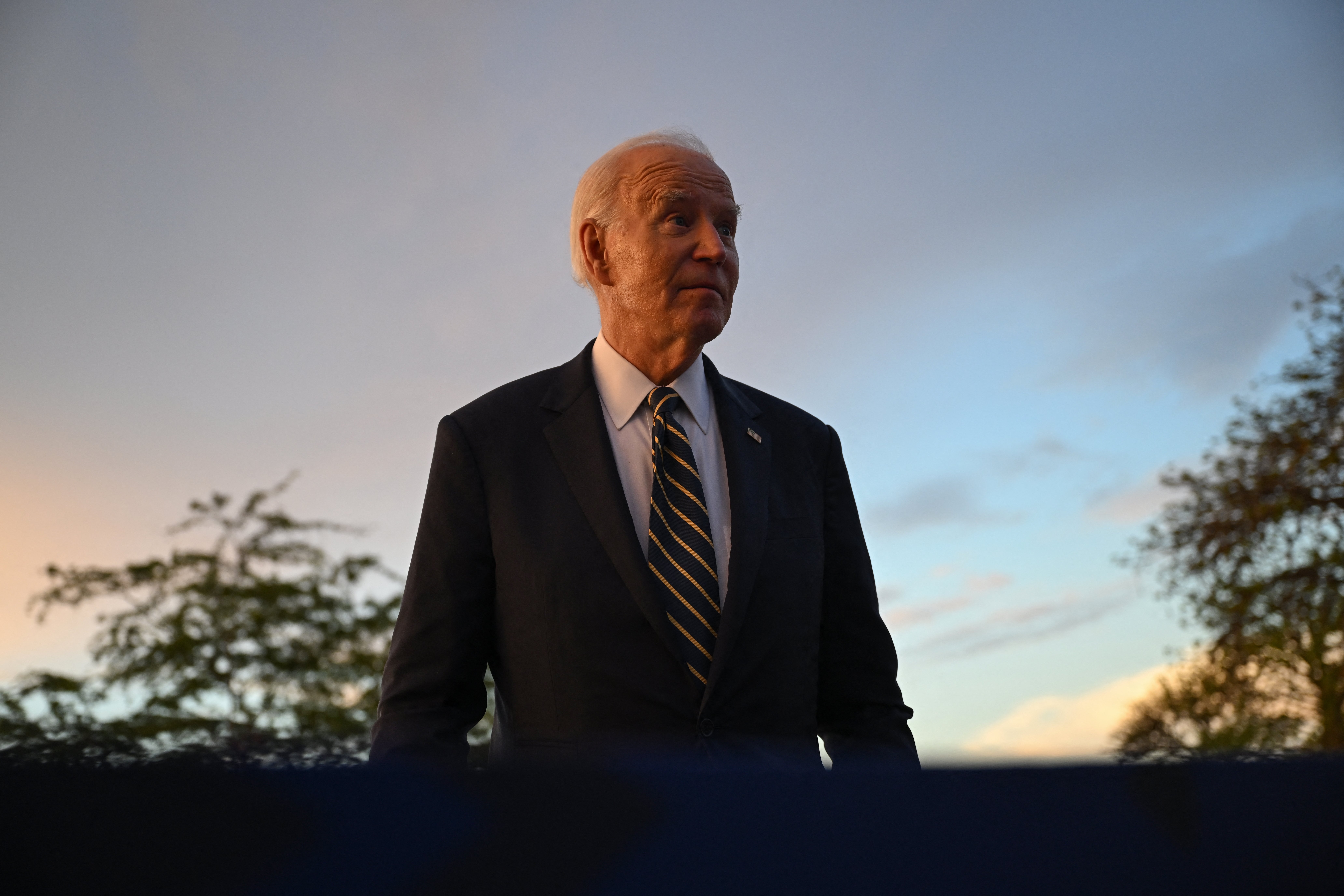 Joe Biden speaks to the press during his visit to the National Slavery Museum in Morro da Cruz, near Luanda, earlier this week. He’s reportedly considering issuing preemptive pardons