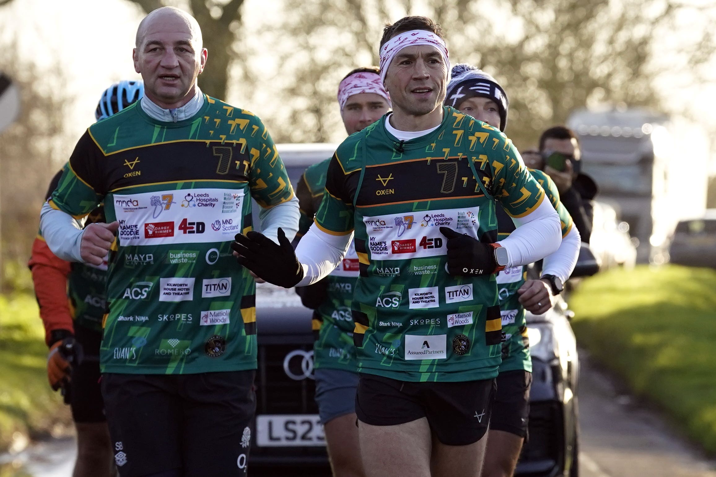 Kevin Sinfield (right) was joined by England head coach Steve Borthwick (left) on the latest leg of his charity challenge (Andrew Matthews/PA)