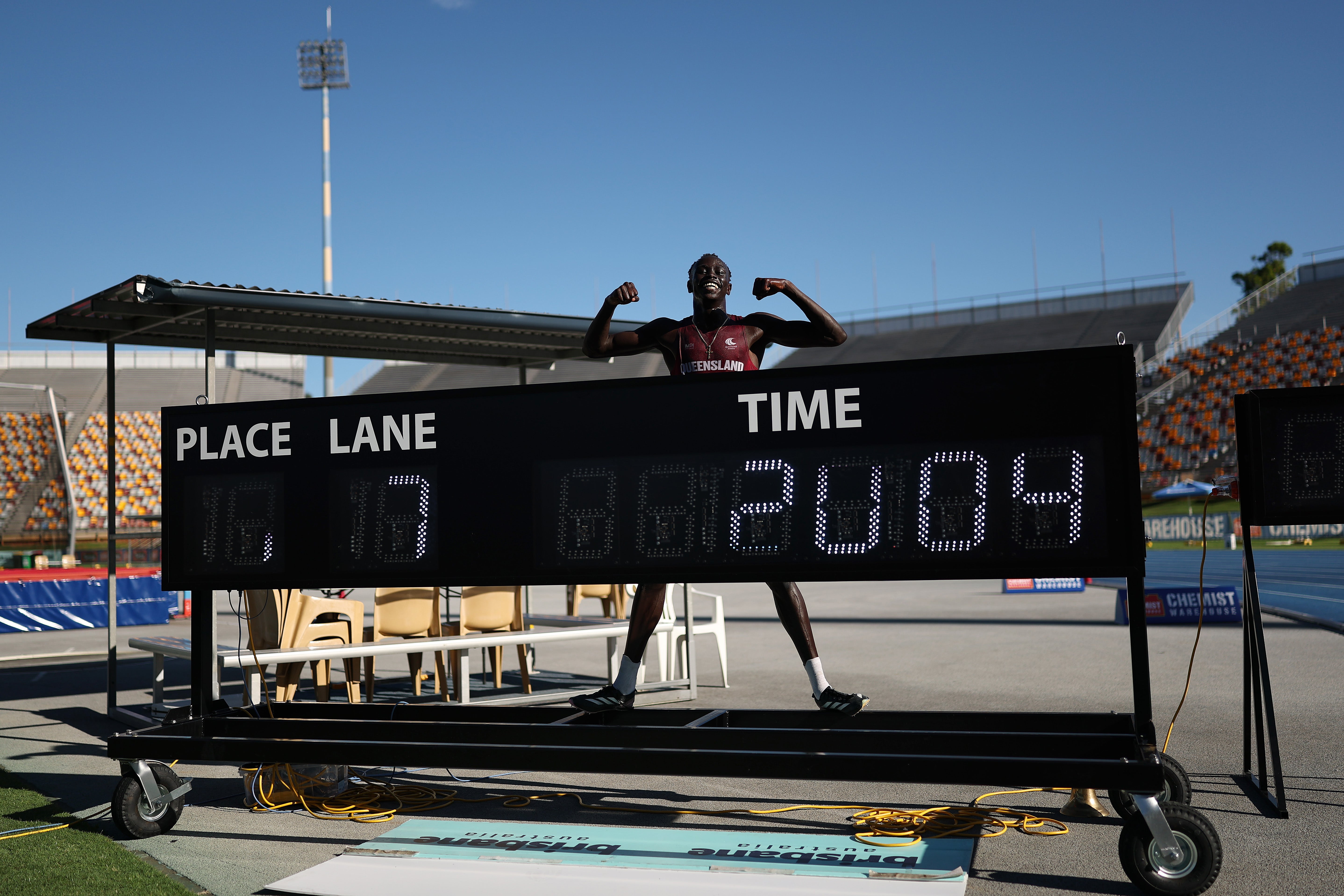 Gout Gout of Queensland celebrates winning the Boys’ U18 200m Final in a new national time