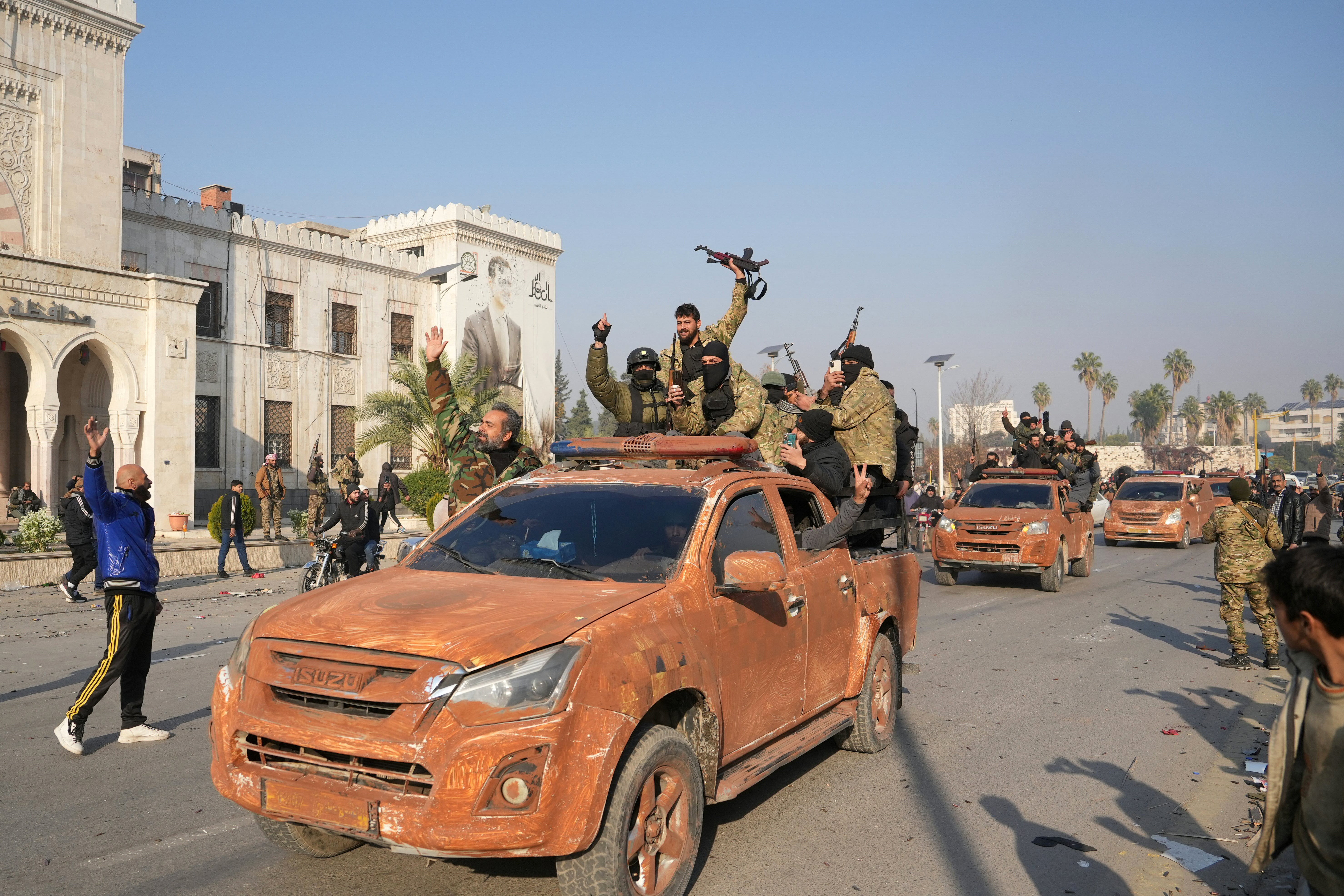 Anti-government fighters celebrate in Hama