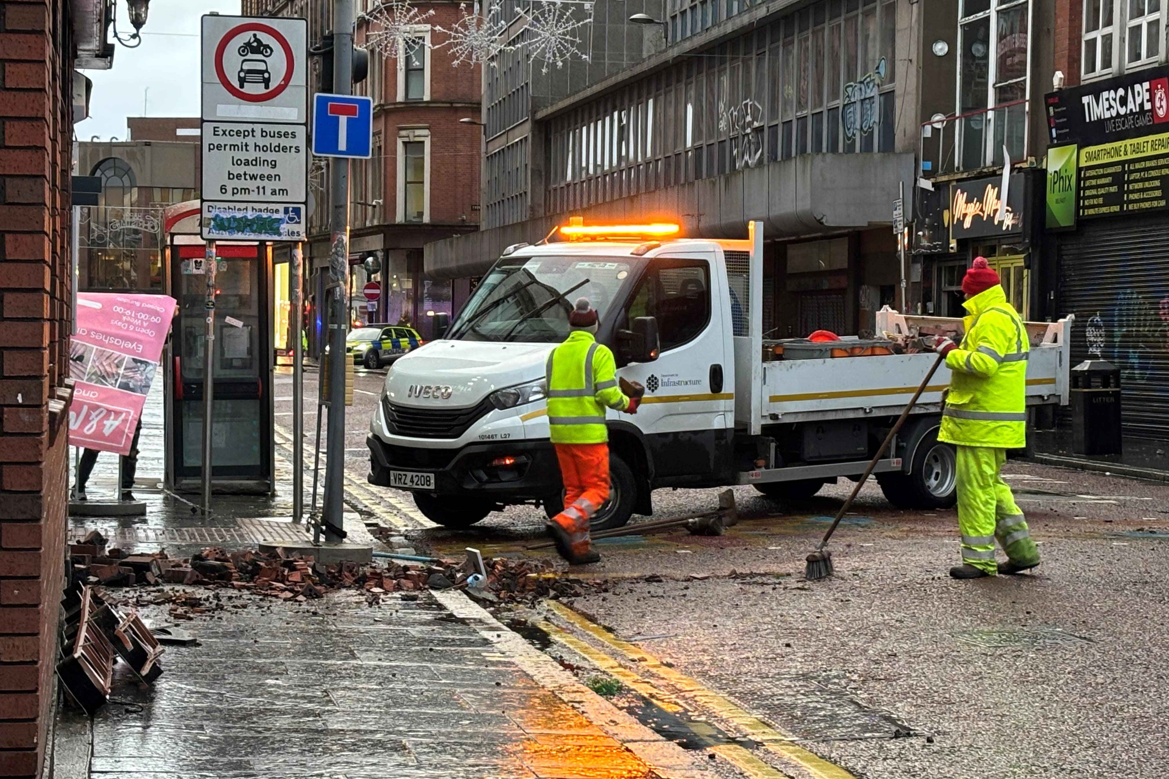 The clean-up operation on Castle Street in Belfast city centre after overnight damage caused by Storm Darragh (Rebecca Black/PA)