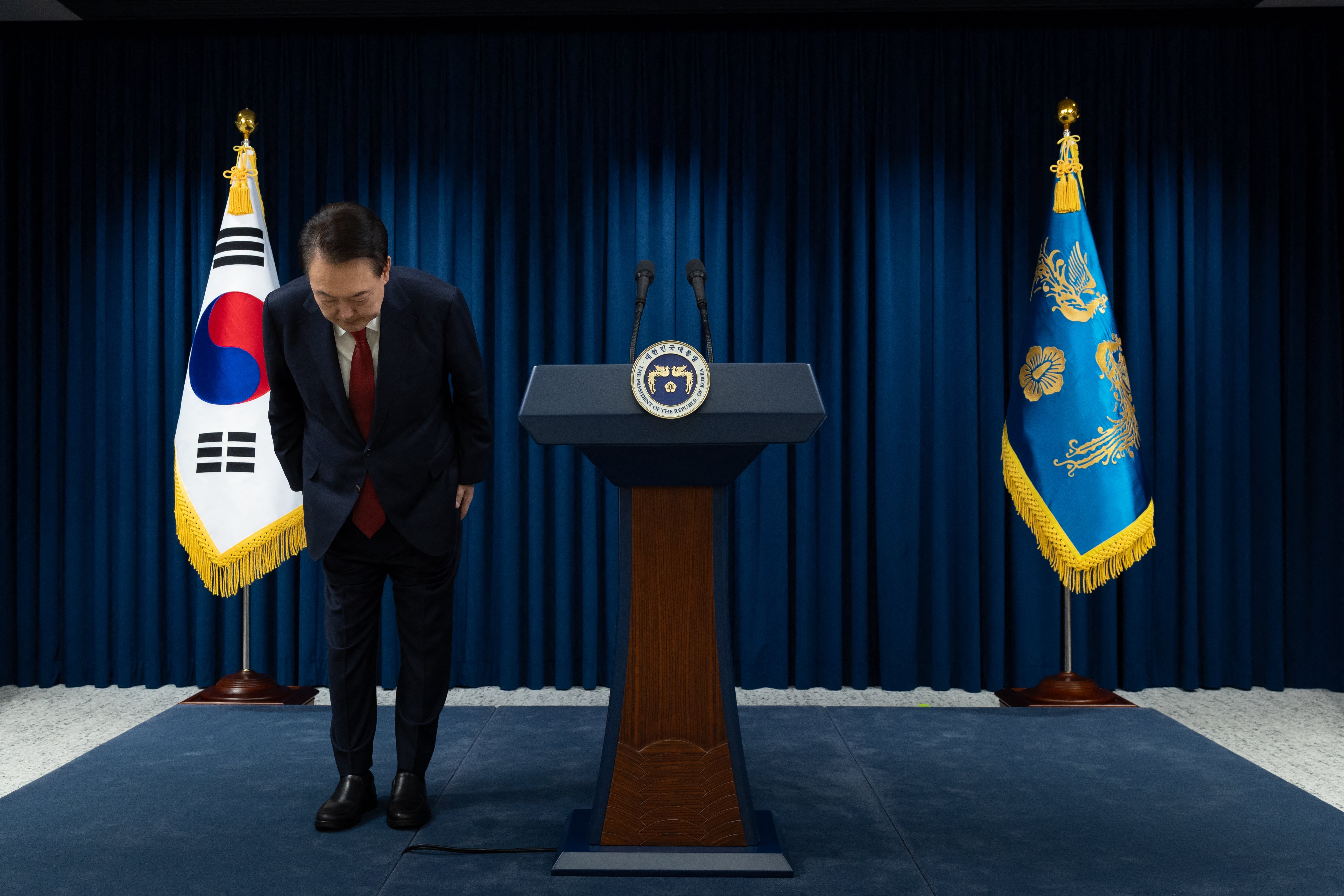 The president bows after the end of his address at the presidential office in Seoul on Saturday