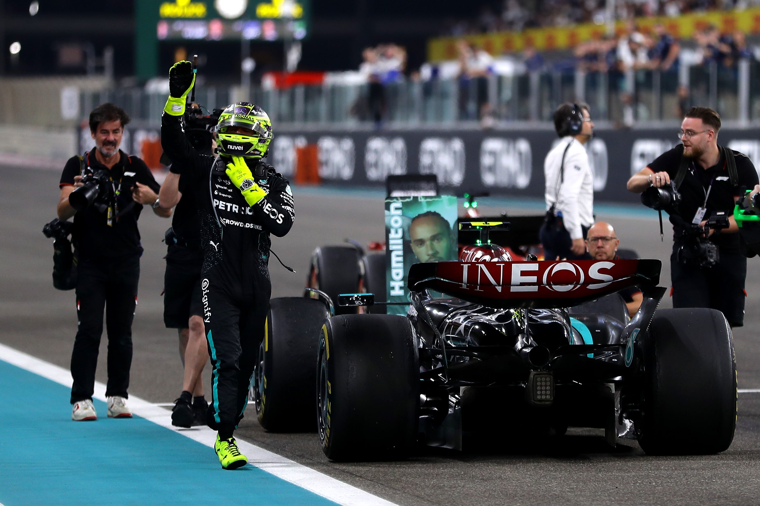 Lewis Hamilton waves to the fans after his final race for Mercedes