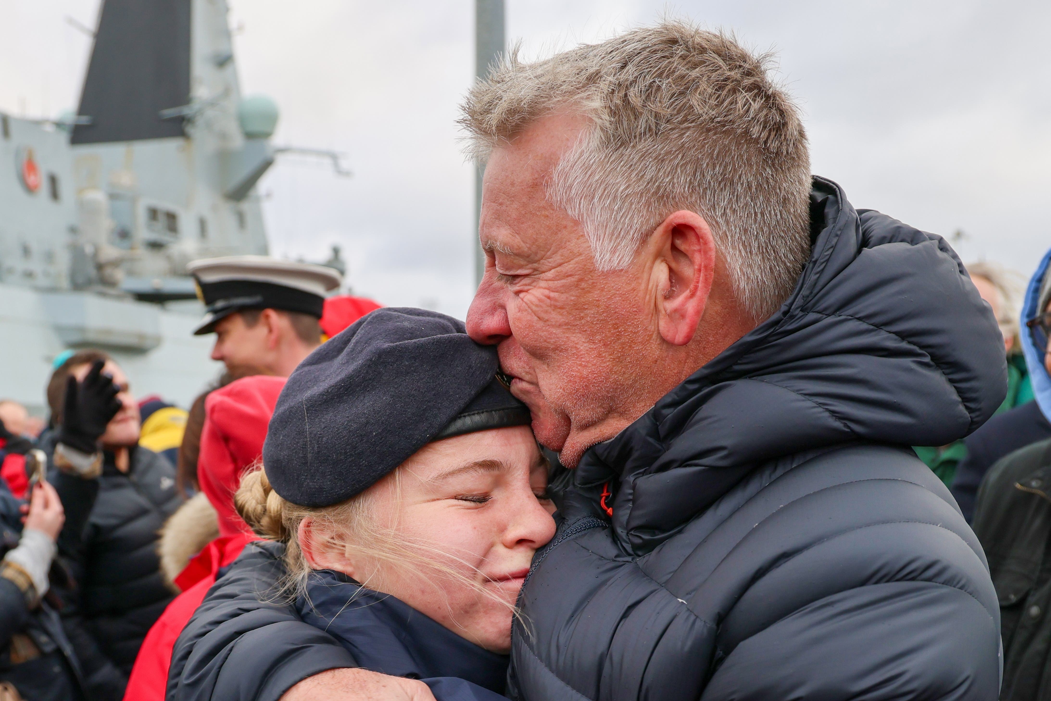 Families gathered at Portsmouth harbour to welcome home the ship’s company (LPhot Alika Mundy/PA)