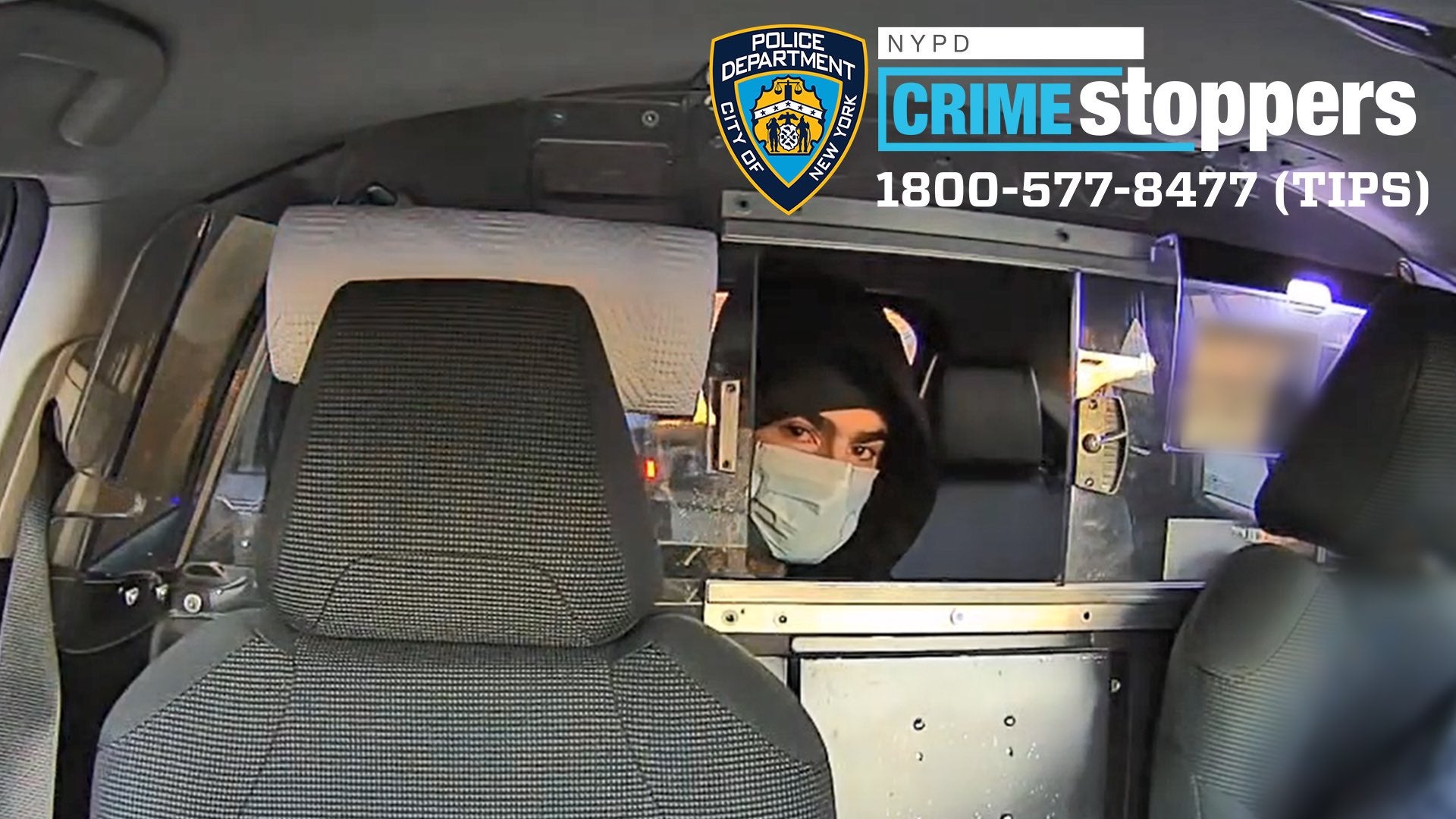 The man suspected of shooting UnitedHealthcare CEO Brian Thompson pictured in a taxi in a new photo released by the New York Police Department