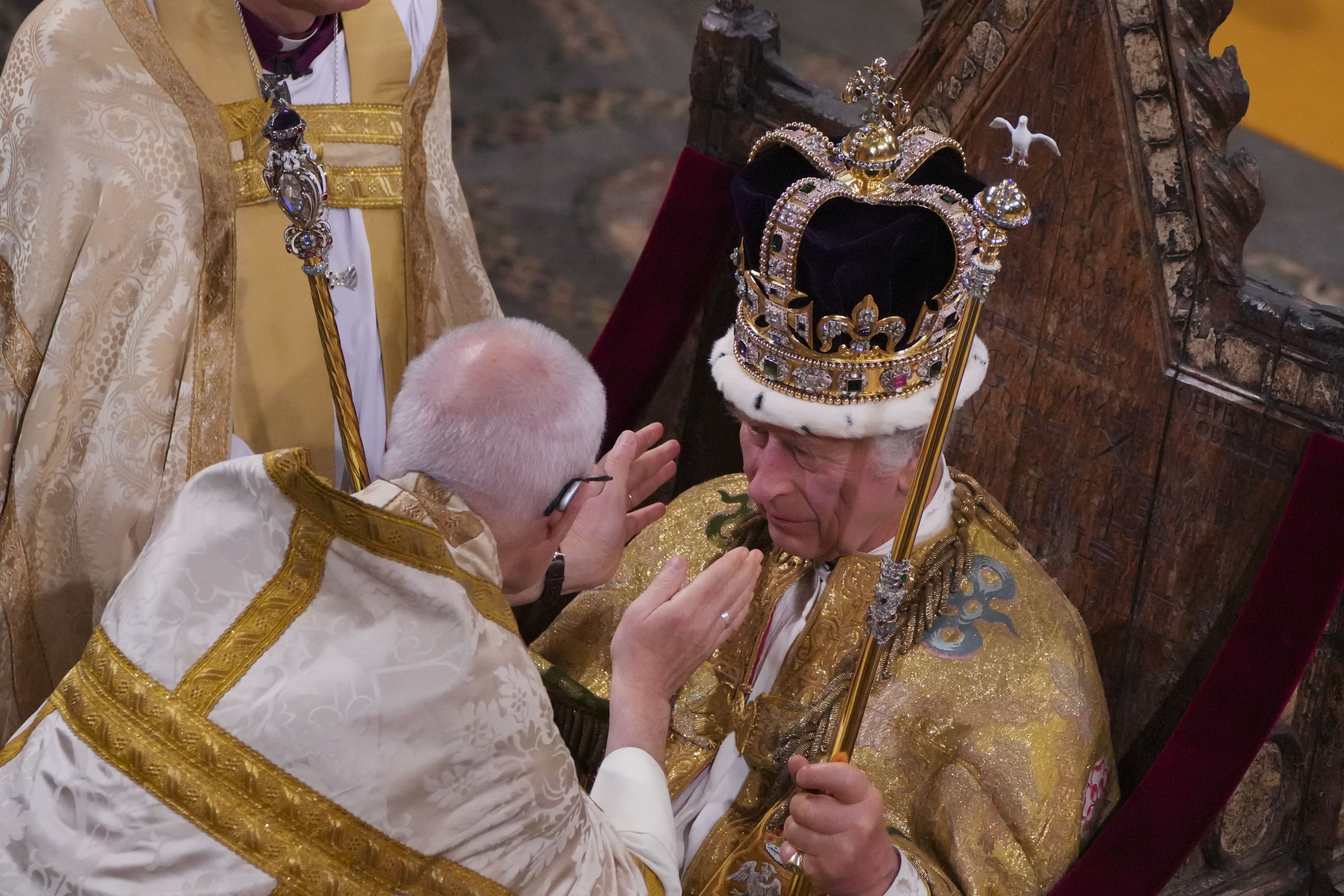 The Archbishop of Canterbury lowers the St Edward’s Crown onto the King’s head (Aaron Chown/PA)