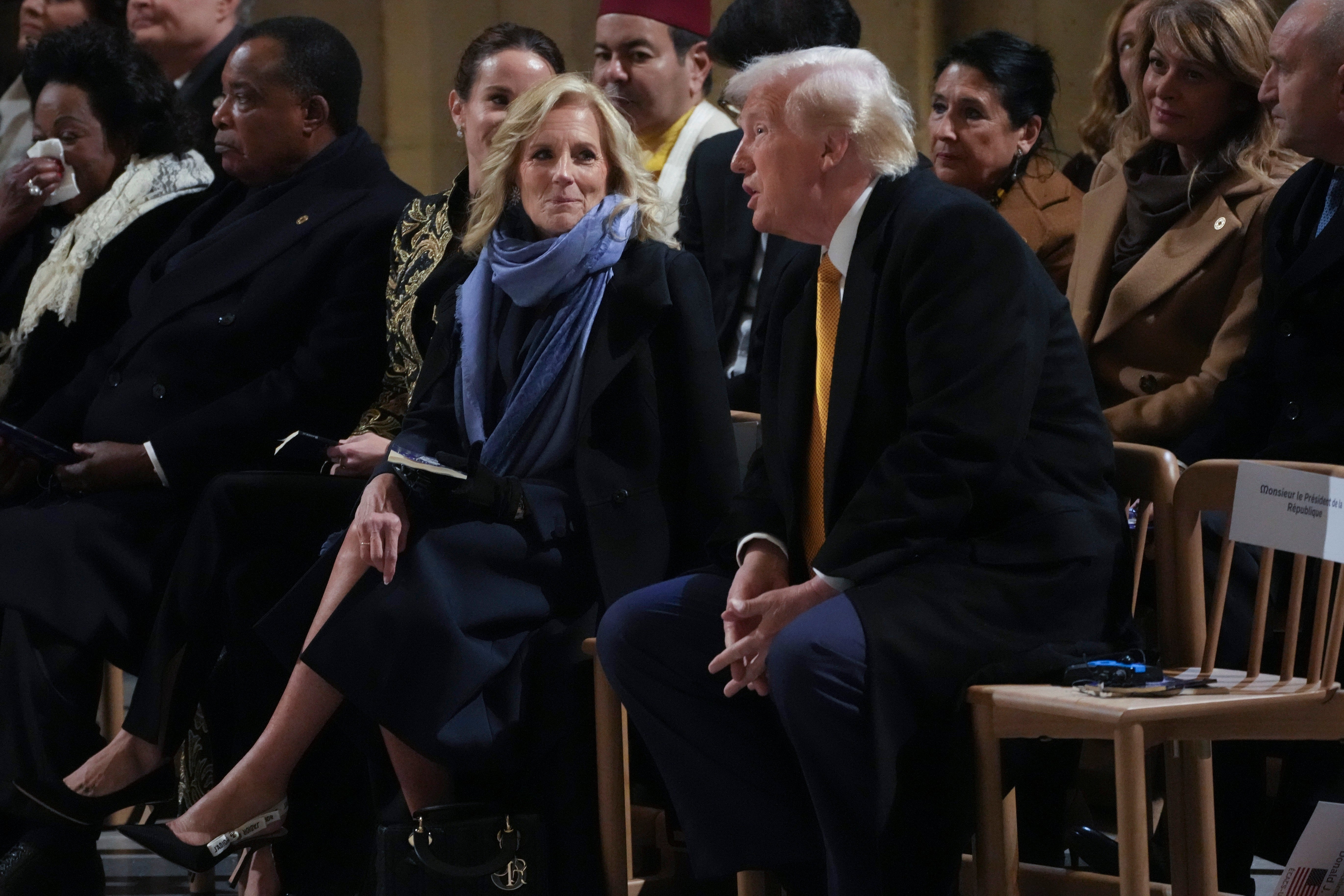 President-elect Donald Trump and First Lady Jill Biden talk at the reopening ceremony for Paris’s Notre Dame Cathedral