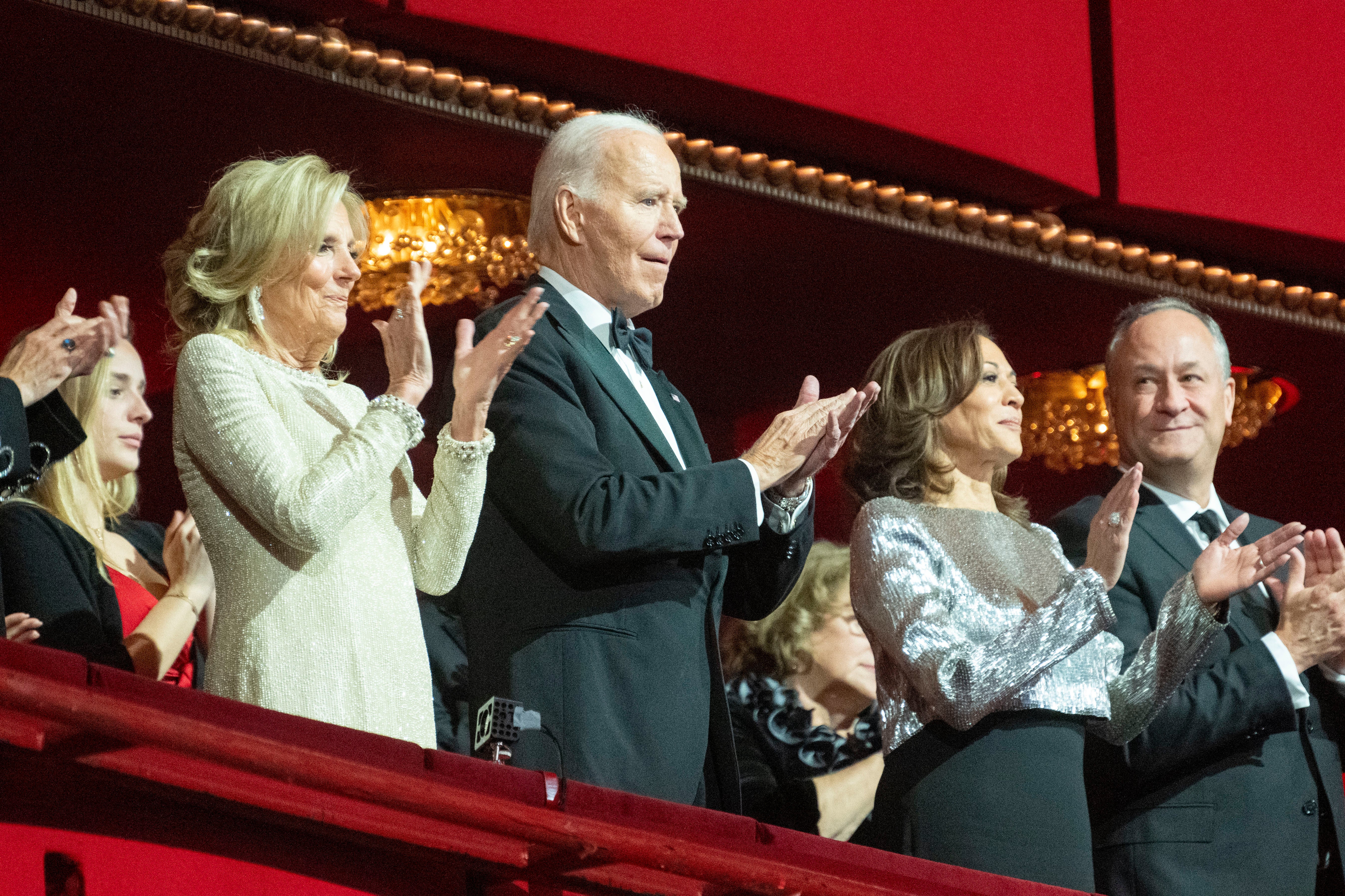 President Joe Biden claps at the start of the Kennedy Center Honors Gala with First Lady Jill Biden, left, Vice President Kamala Harris, center right, and Second Gentleman Doug Emhoff, right, Sunday, Dec. 8, 2024, in Washington. (AP Photo/Kevin Wolf)