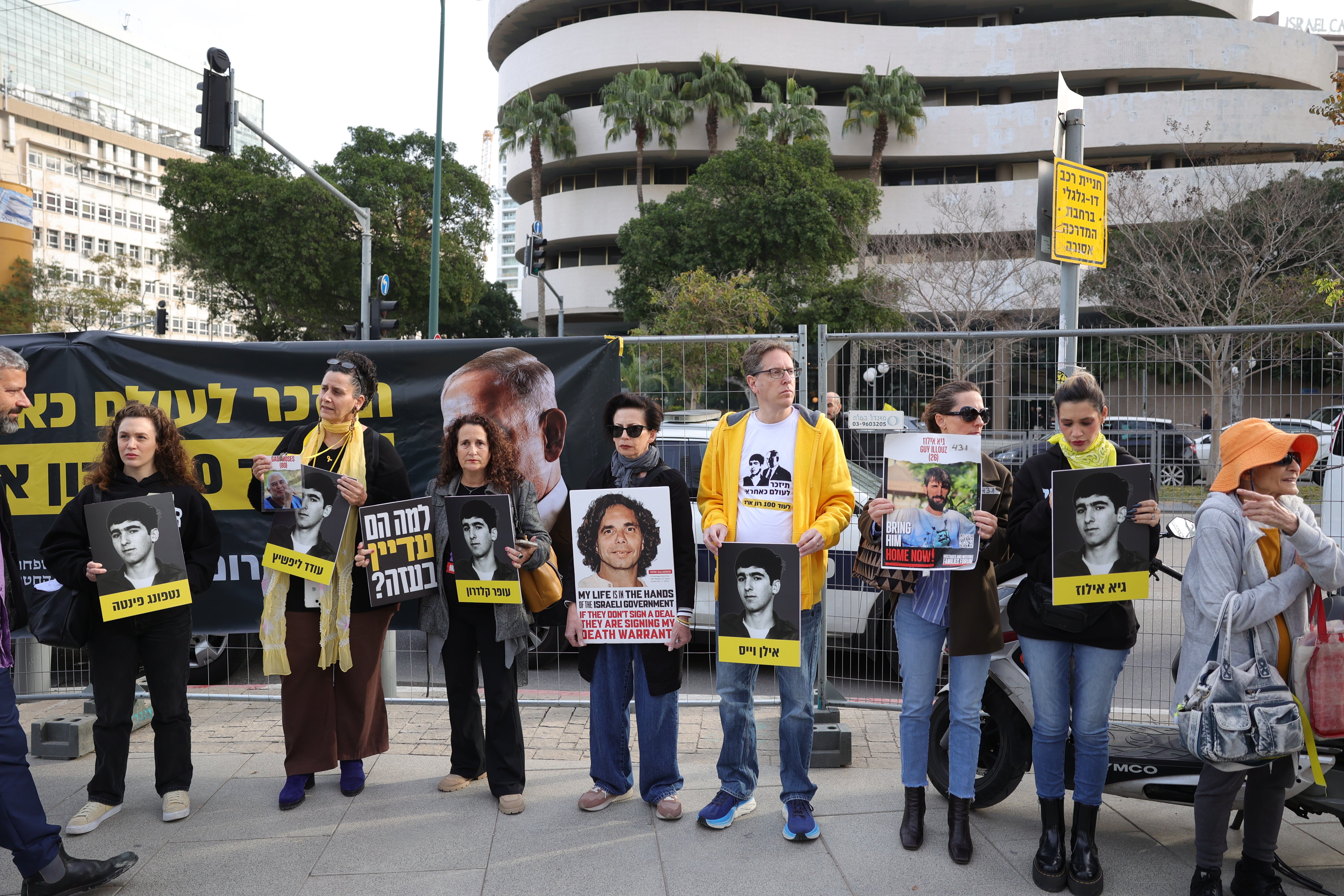 Families of Israeli captives held by Hamas in Gaza gather to call for a hostage deal outside the district court in Tel Aviv