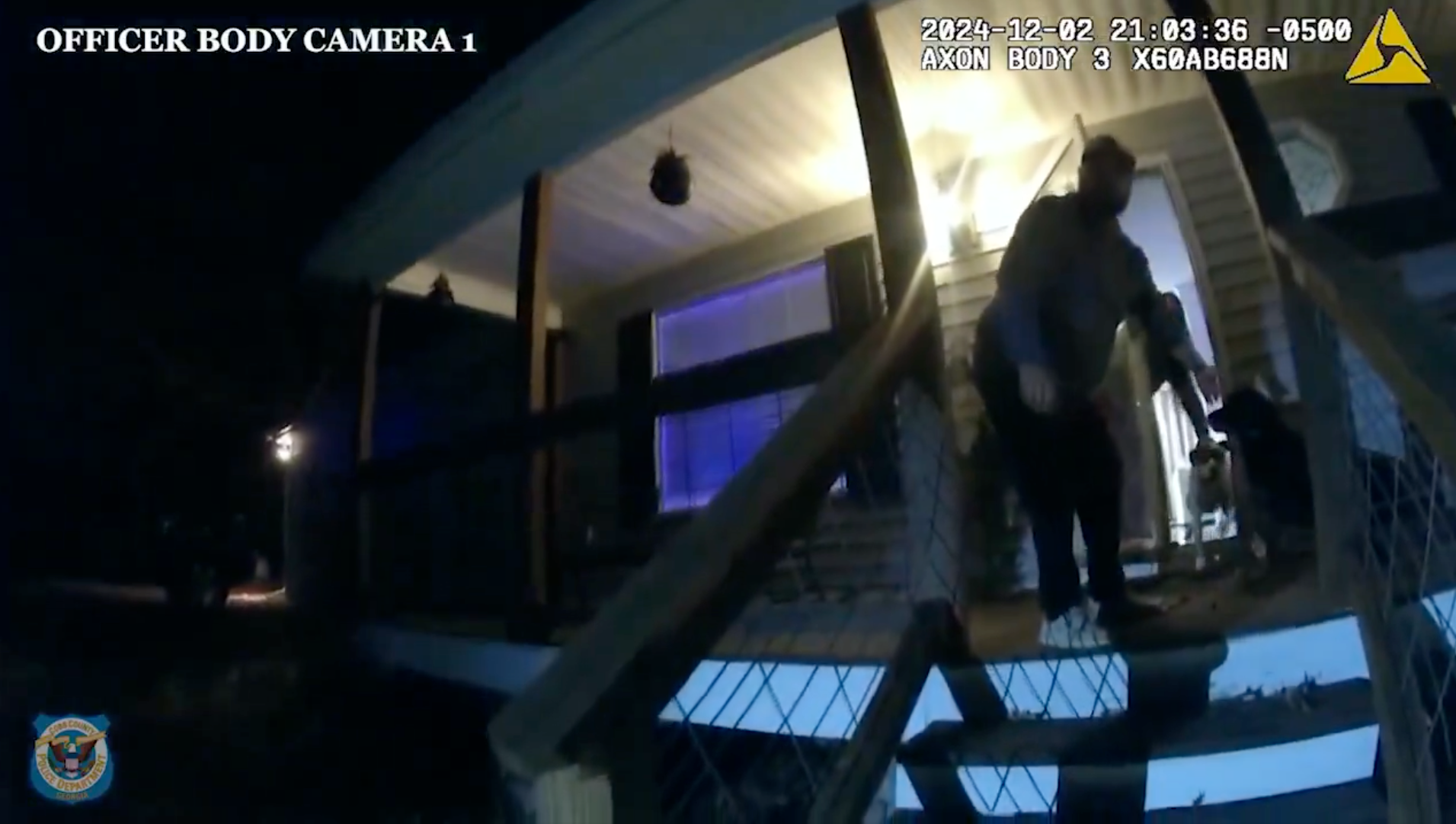 Footage shows two officers arriving at the home in Cobb County