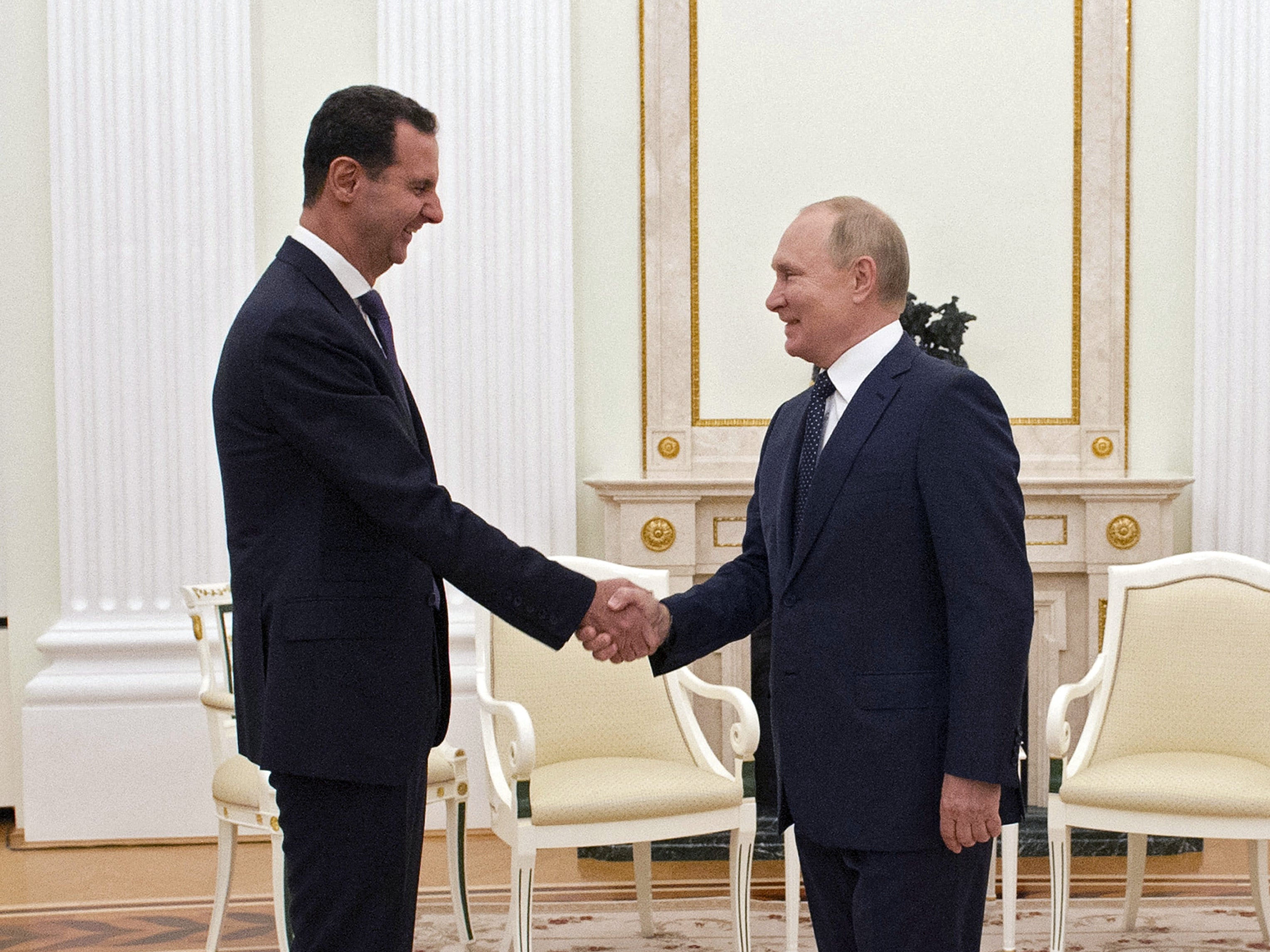 Russian President Vladimir Putin meets with Syrian President Bashar al-Assad