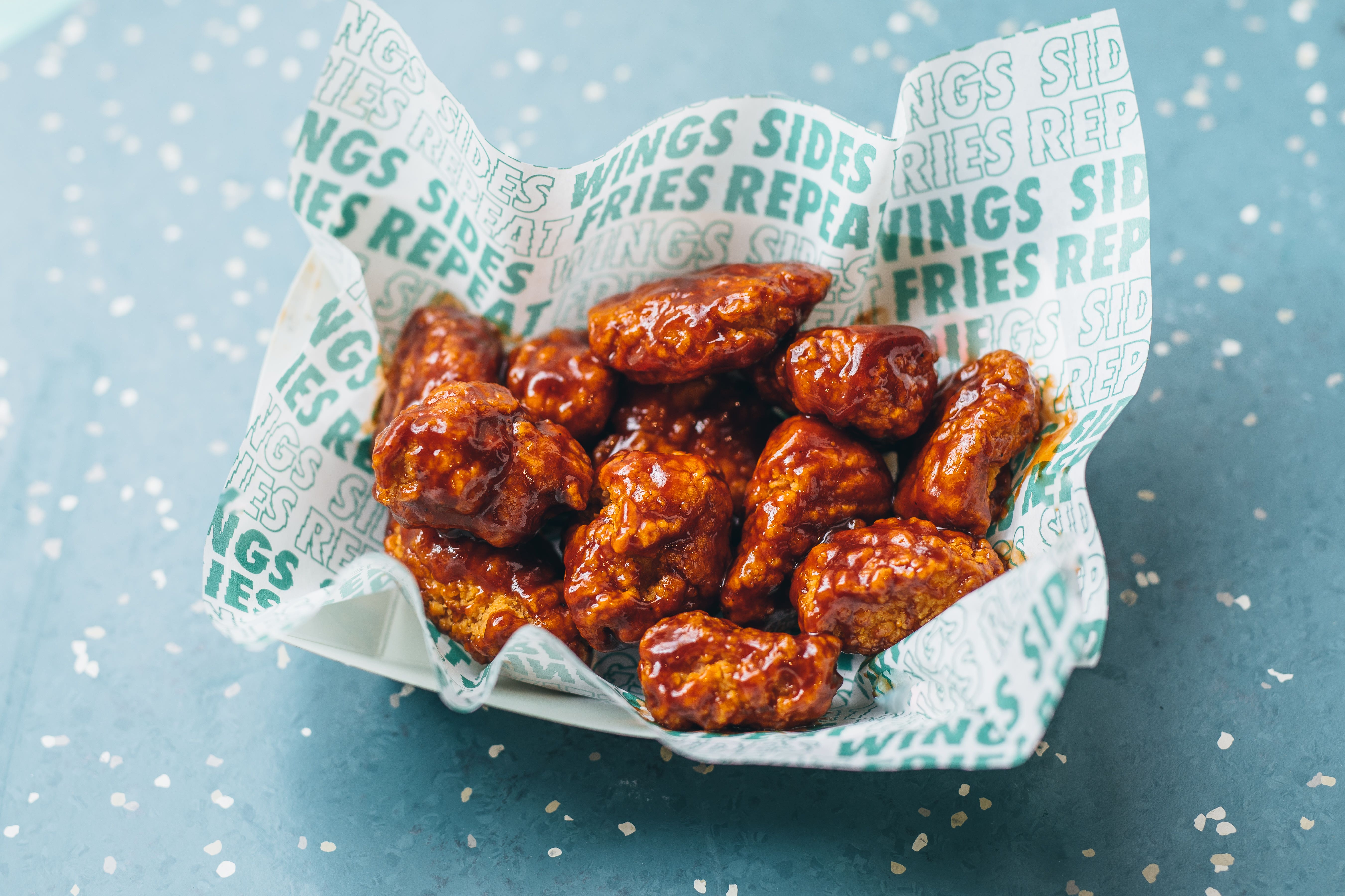 Chicken chain Wingstop is being targeted by suitors including Domino’s for a takeover deal (Deliveroo/PA)