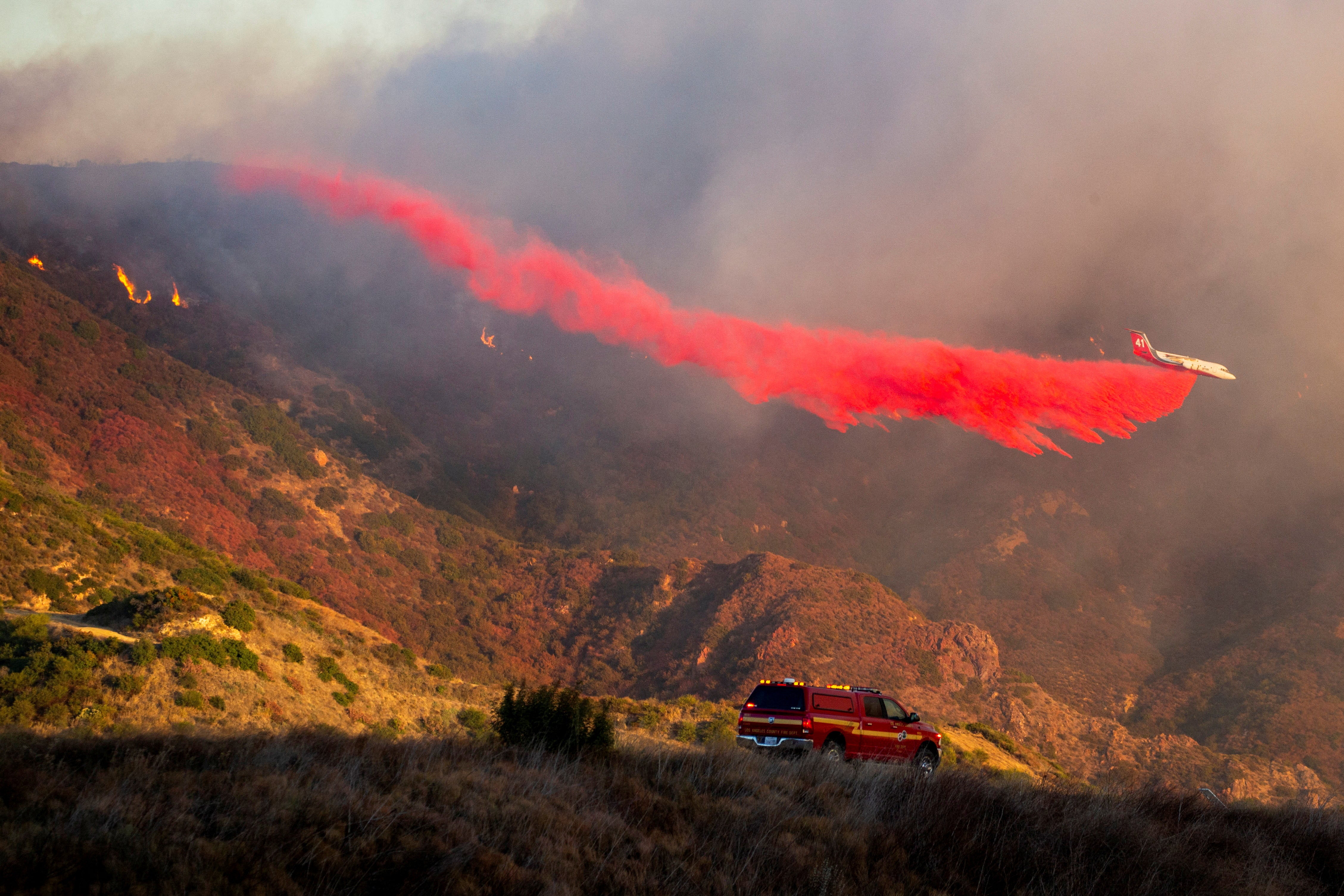 An air tanker drops retardant as the Franklin Fire burns in Malibu, Californi