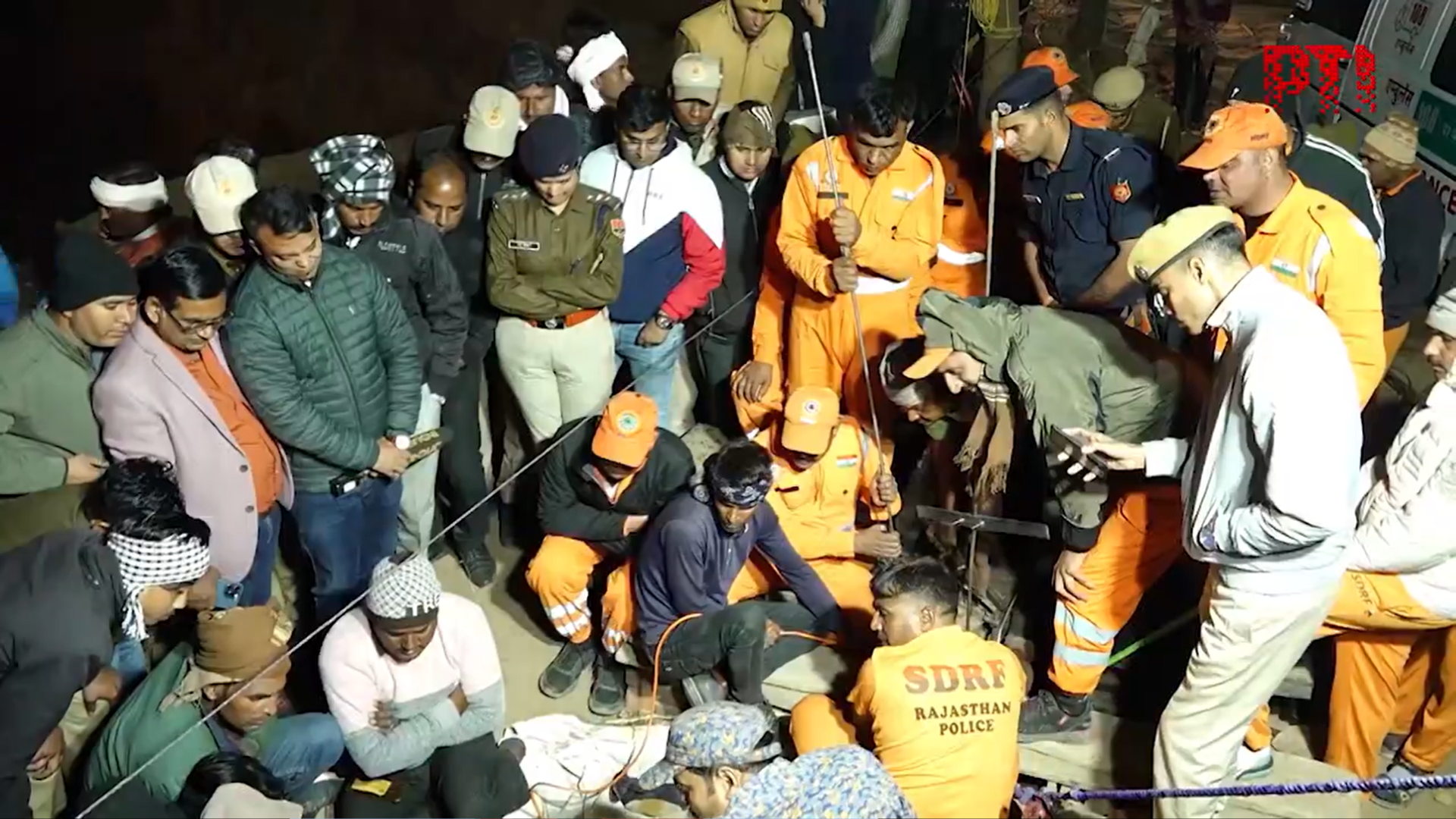 Rescue teams work to save a five-year-old boy who fell inside an 150ft deep borewell in Rajasthan, India