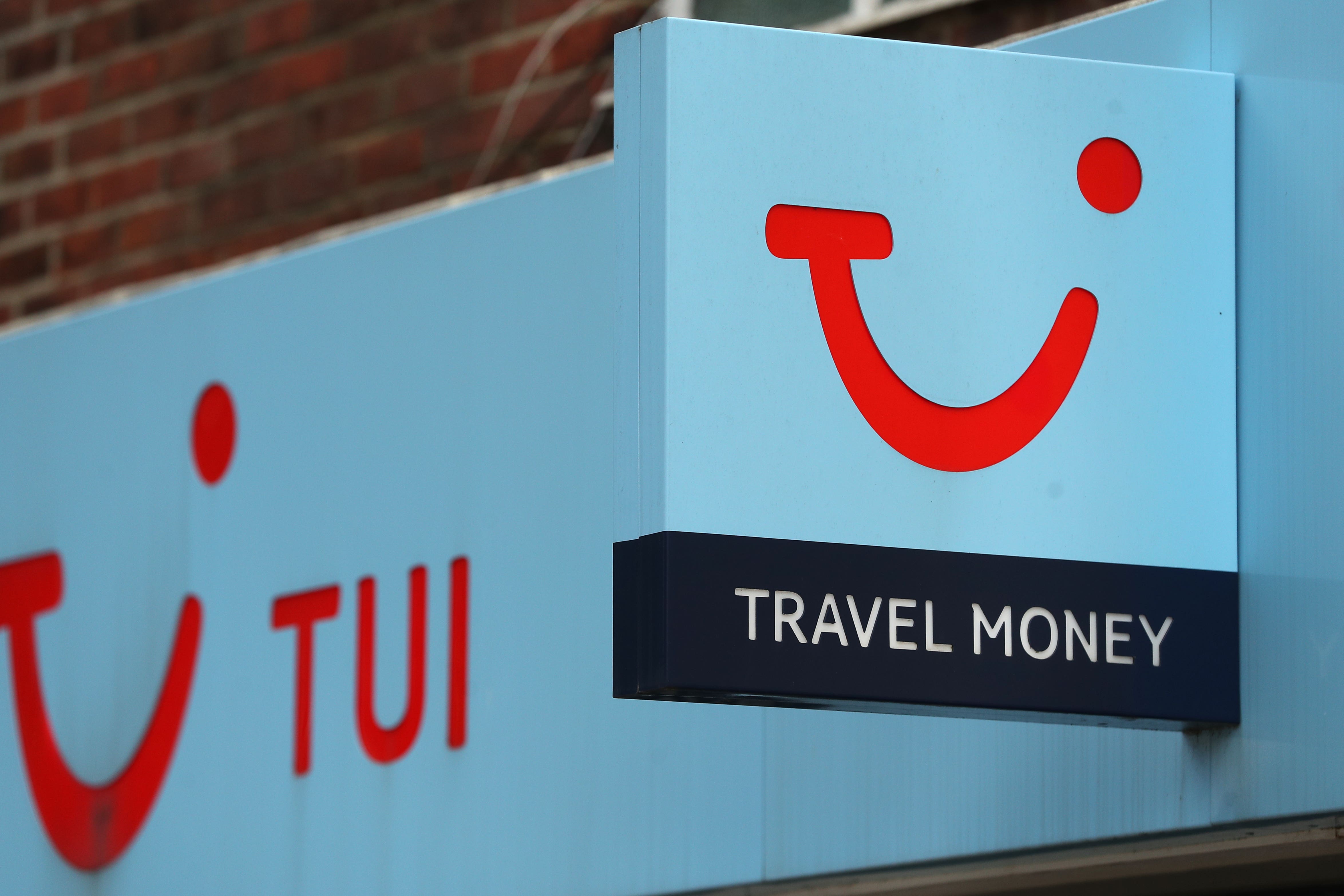 Travel firm Tui has seen annual earnings jump by a third (Andrew Matthews/PA)