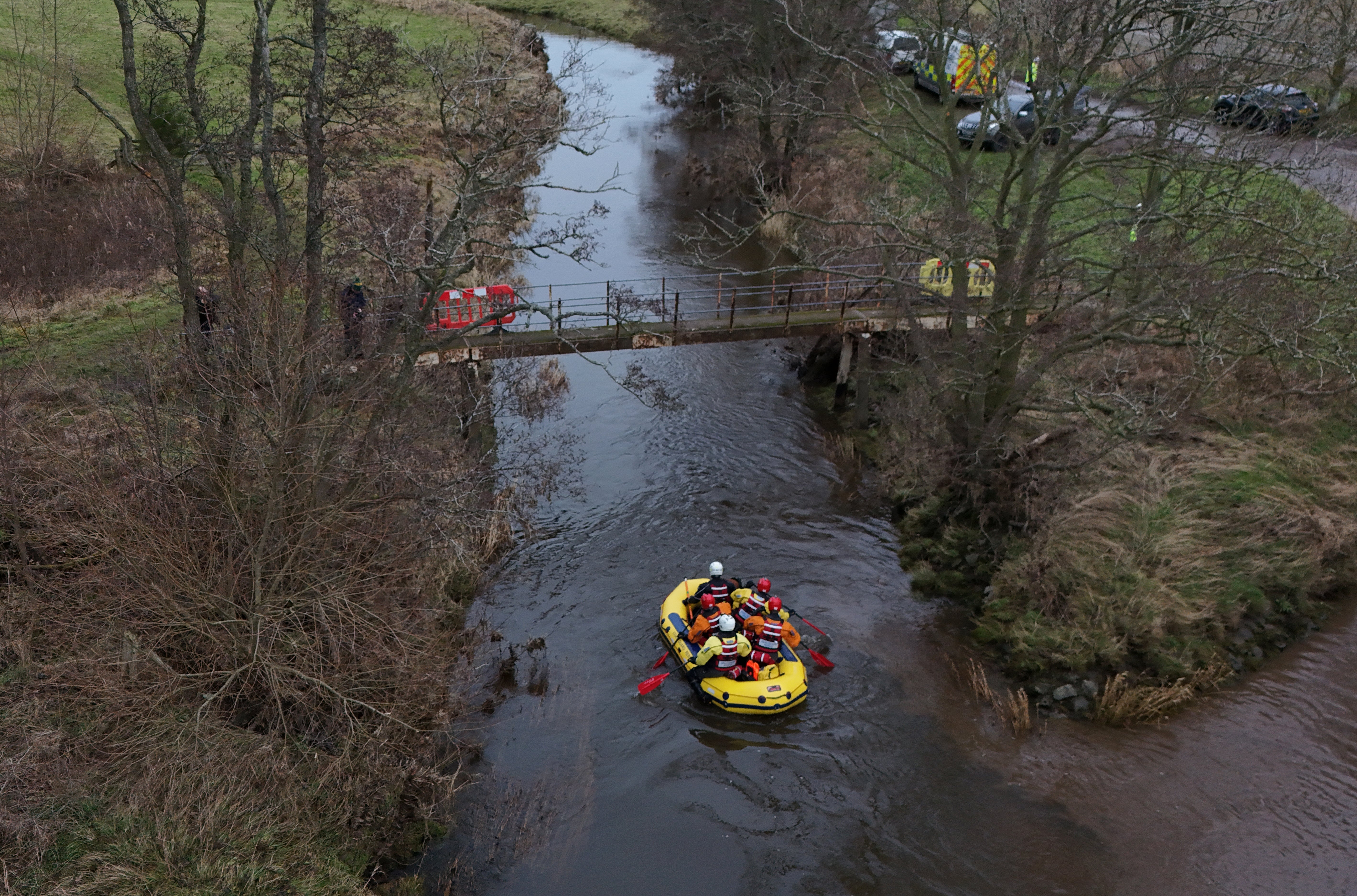 Divers are continuing to scour the flood-swollen river where former England rugby union star Tom Voyce is believed to have died