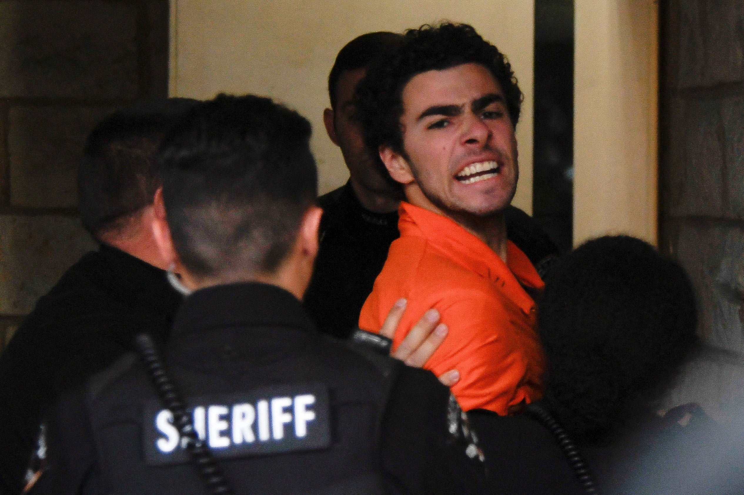 Luigi Mangione, 26, a suspect in the New York City killing of UnitedHealth executive Brian Thompson, arrives for an extradition hearing at Blair County Court House in Hollidaysburg, Pennsylvania, U.S. December 10, 2024.