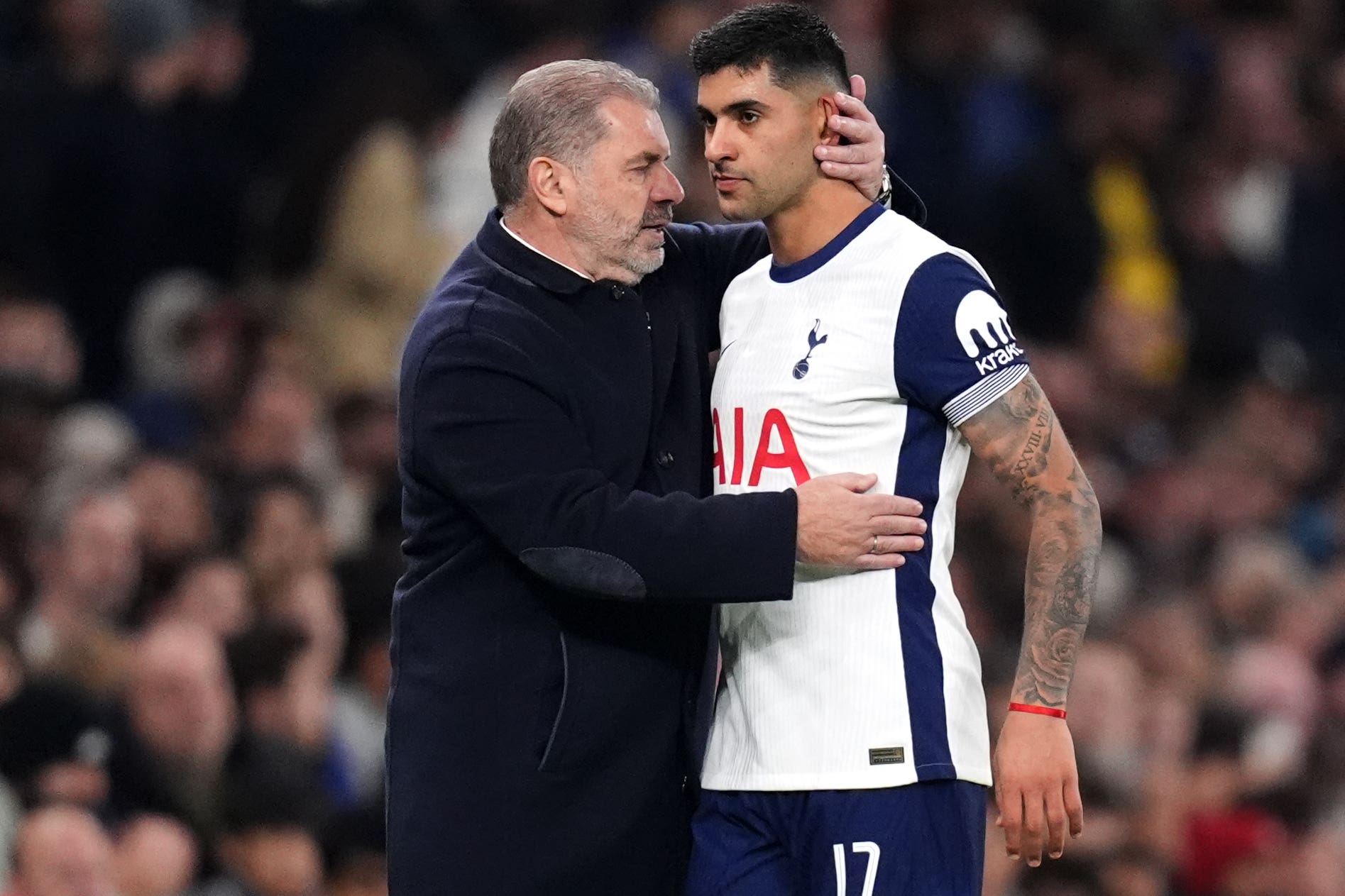 Ange Postecoglou with Cristian Romero at Tottenham Hotspur Stadium (John Walton/PA)