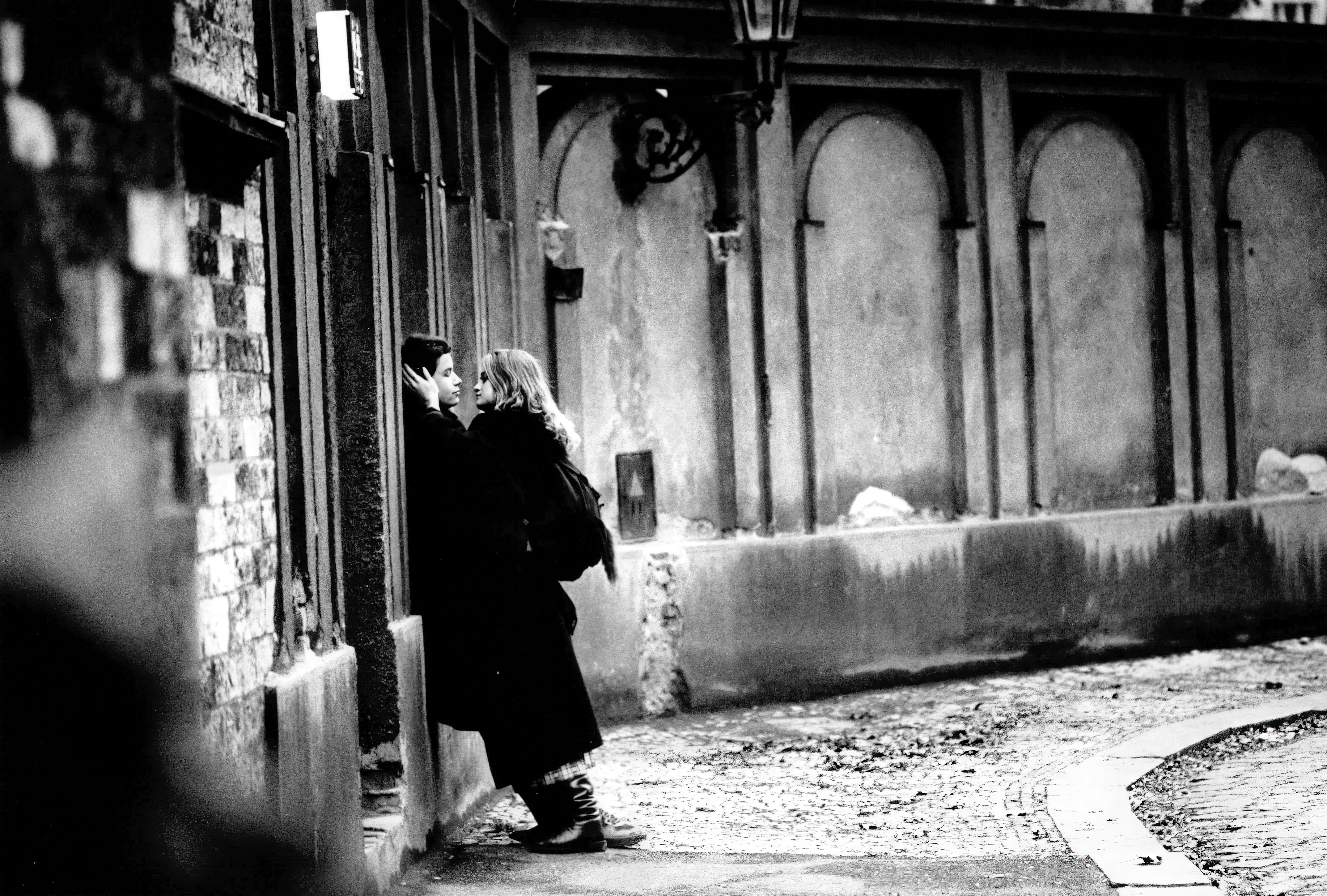 A couple embraces after the fall of the Czech government near the Jewish cemetery, Prague, 1989
