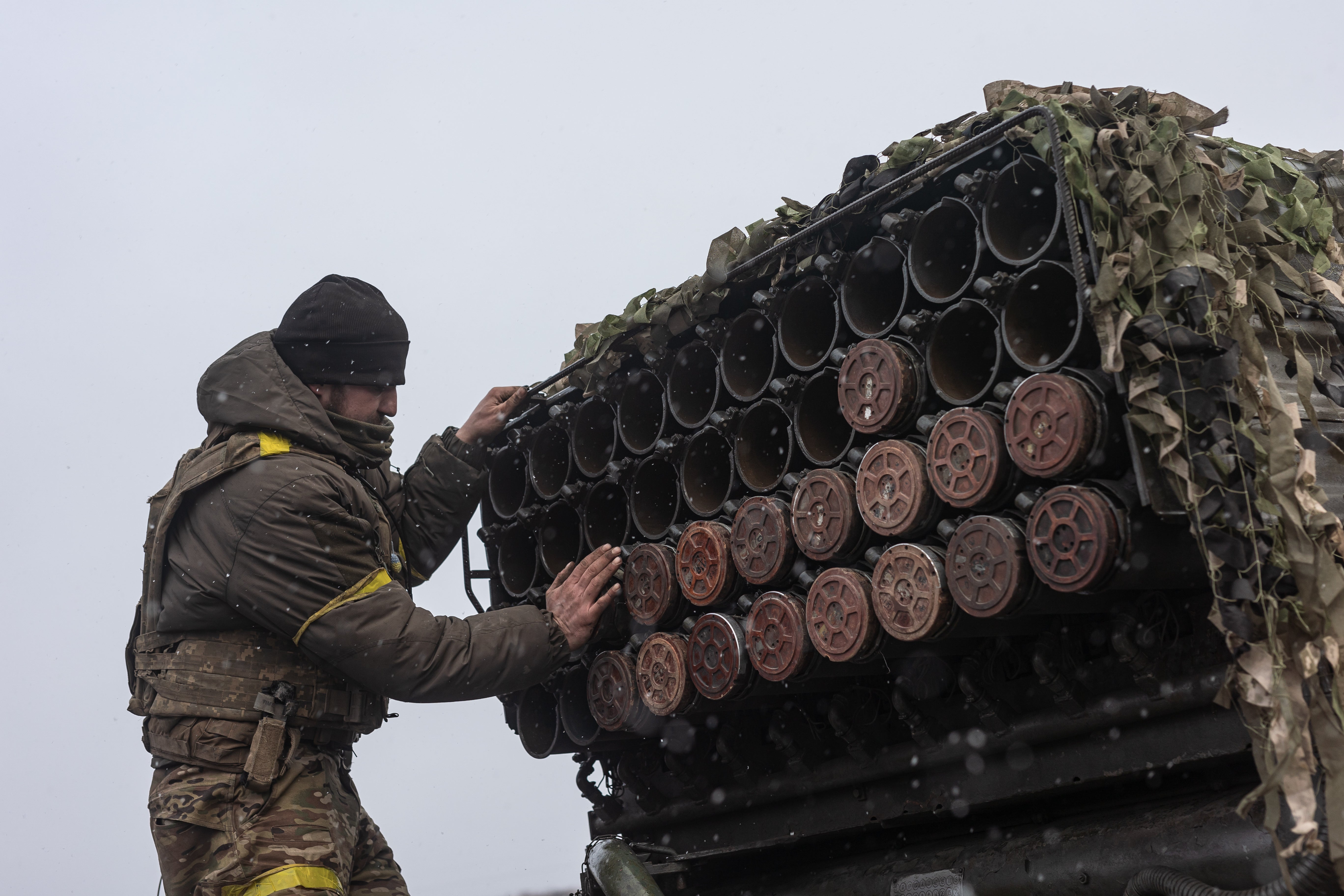 Ukrainian soldiers load grad shells on BM-21 artillery, in their fighting position, in the direction of Kurakhove, Ukraine
