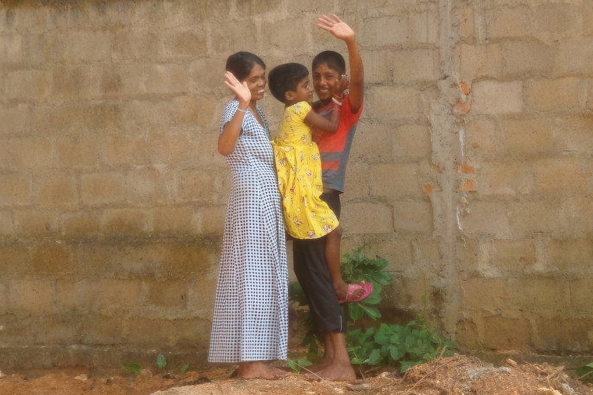 Piyumi, aged six, is reunited with her mum and brother Isuru