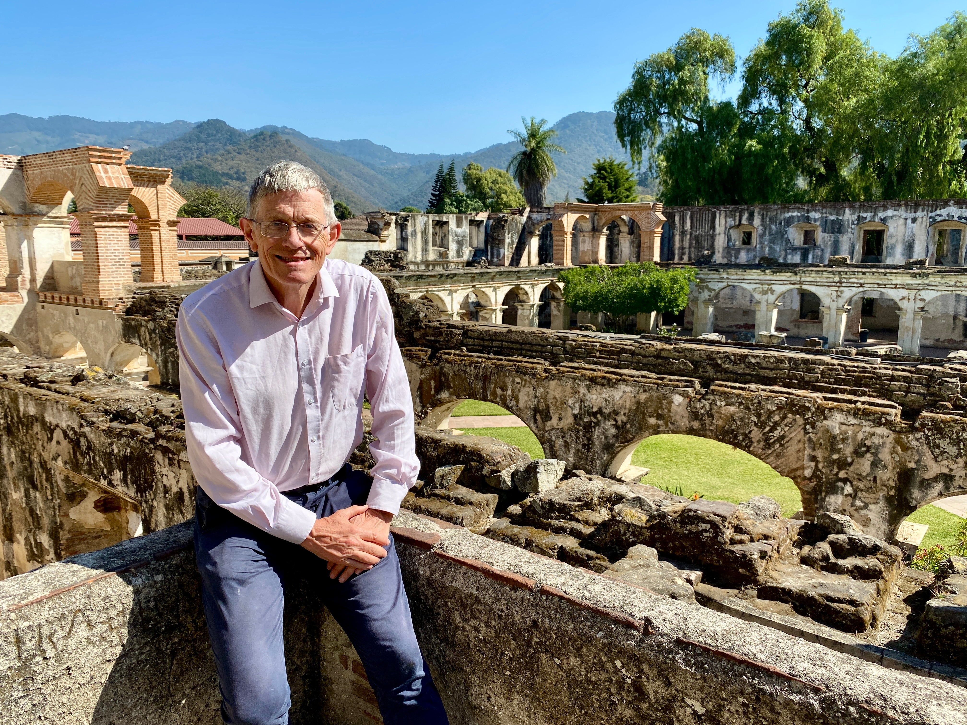 An old ruin in Antigua, Guatemala, with the remains of the Santa Clara monastery in the background