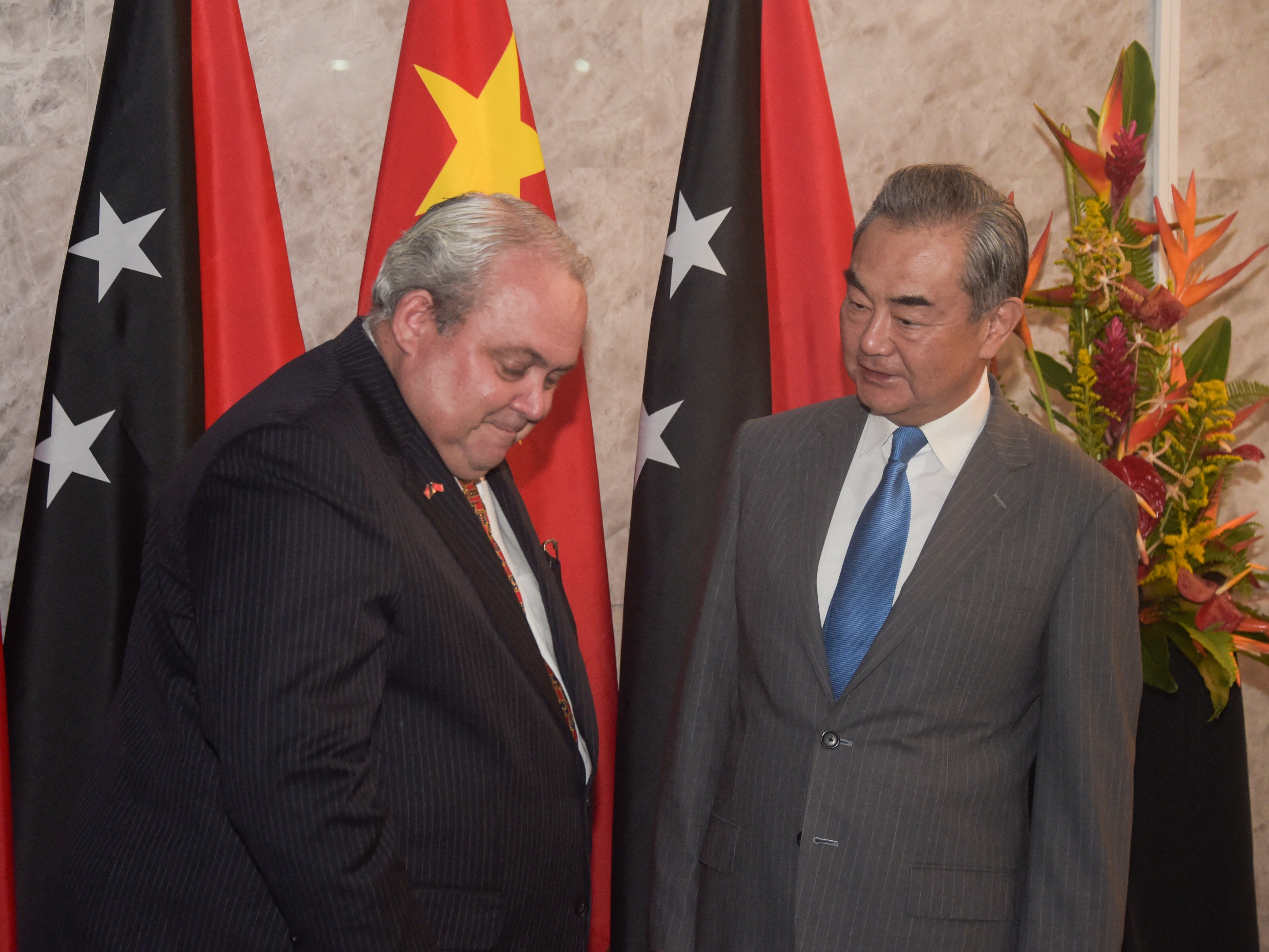 File. Papua New Guinea’s foreign minister Justin Tkatchenko (L) speaks with China’s foreign minister Wang Yi during their bilateral meeting in Port Moresby on 20 April 2024. According to an official statement, Tkatchenko reassured his Chinese counterpart, of Papua New Guinea’s continued support to the ‘One China’ policy, since both countries established diplomatic relations in 1976. ‘This has been the cornerstone of PNG-China relations and will be maintained going forward.’