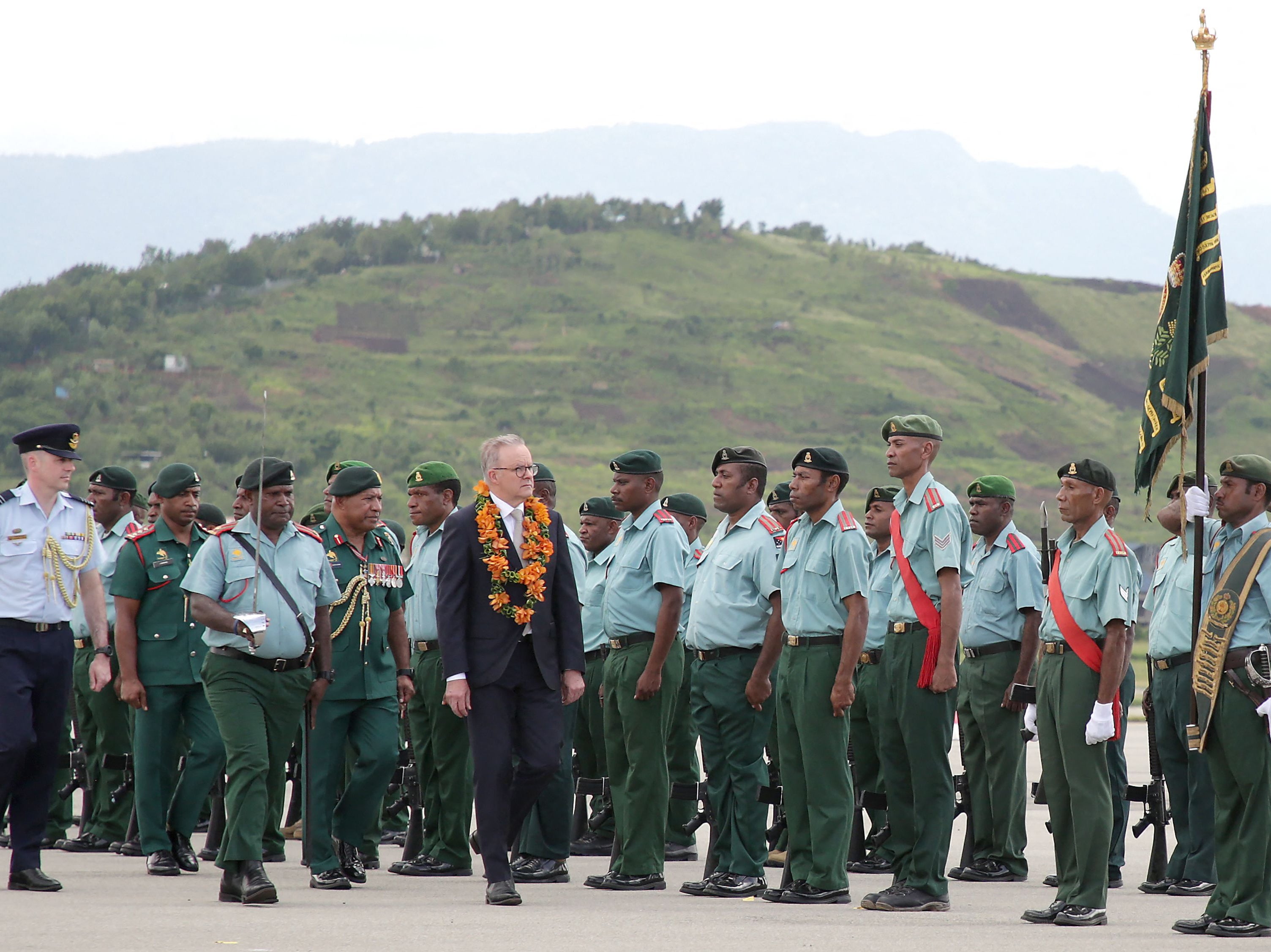 File. Australia’s prime minister Anthony Albanese (C) inspects the guard of honour upon his arrival at Jacksons International Airport in Papua New Guinea’s capital Port Moresby on 12 January 2023